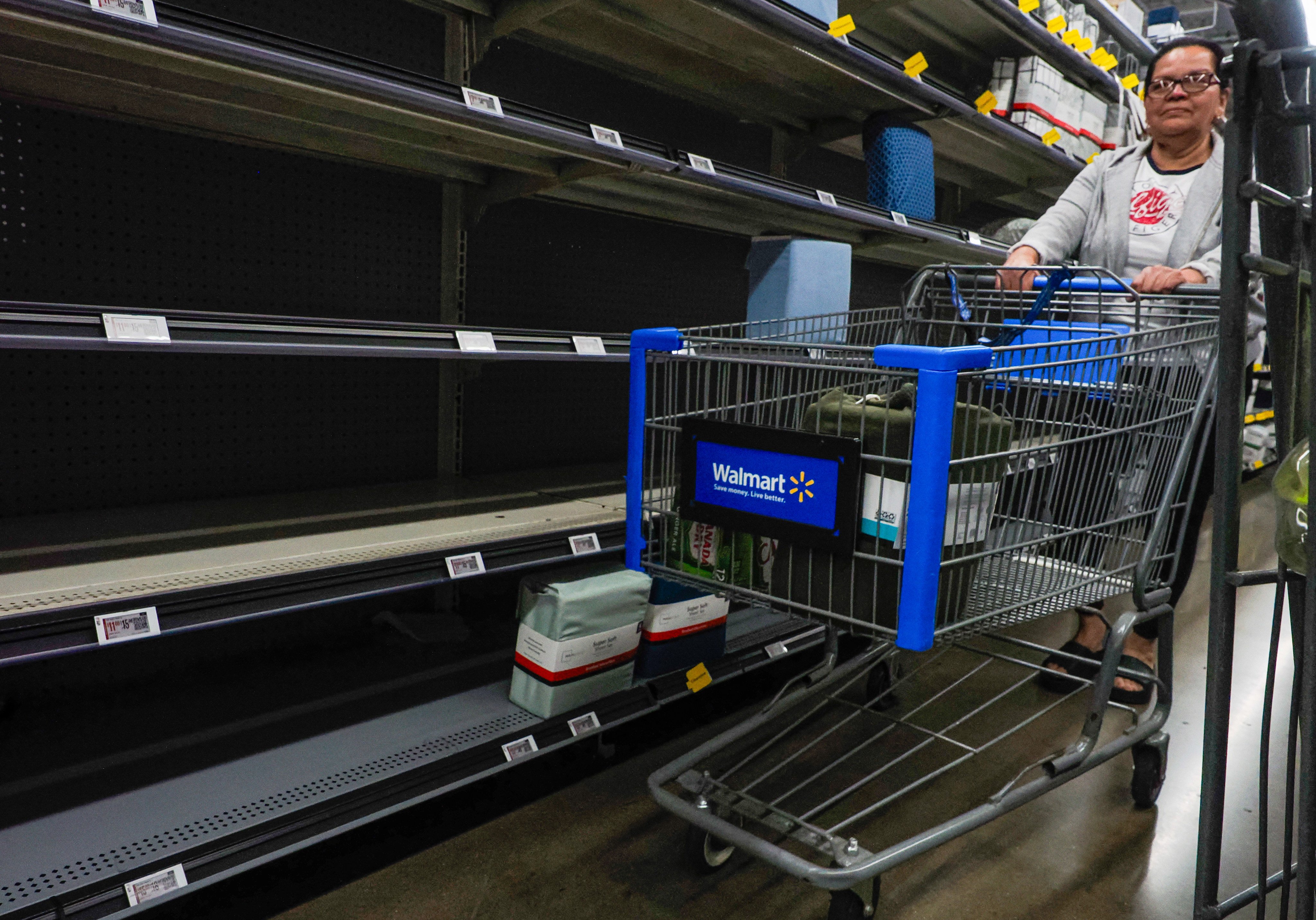 Partially empty shelves of bedsheet fittings made in China are seen at a Walmart store in California last month. Photo: EPA-EFE