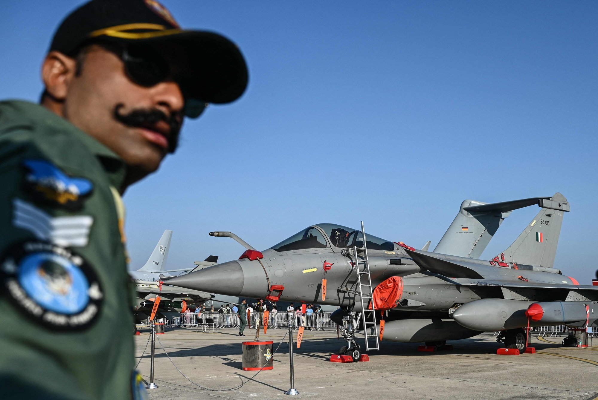 An Indian Air Force officer stands in front of a Rafale fighter jet during a military aviation exhibition in Bengaluru on February 13. Photo: AFP An Indian Air Force officer stands in front of a Rafale fighter jet during a military aviation exhibition in Bengaluru on February 13. Photo: AFP