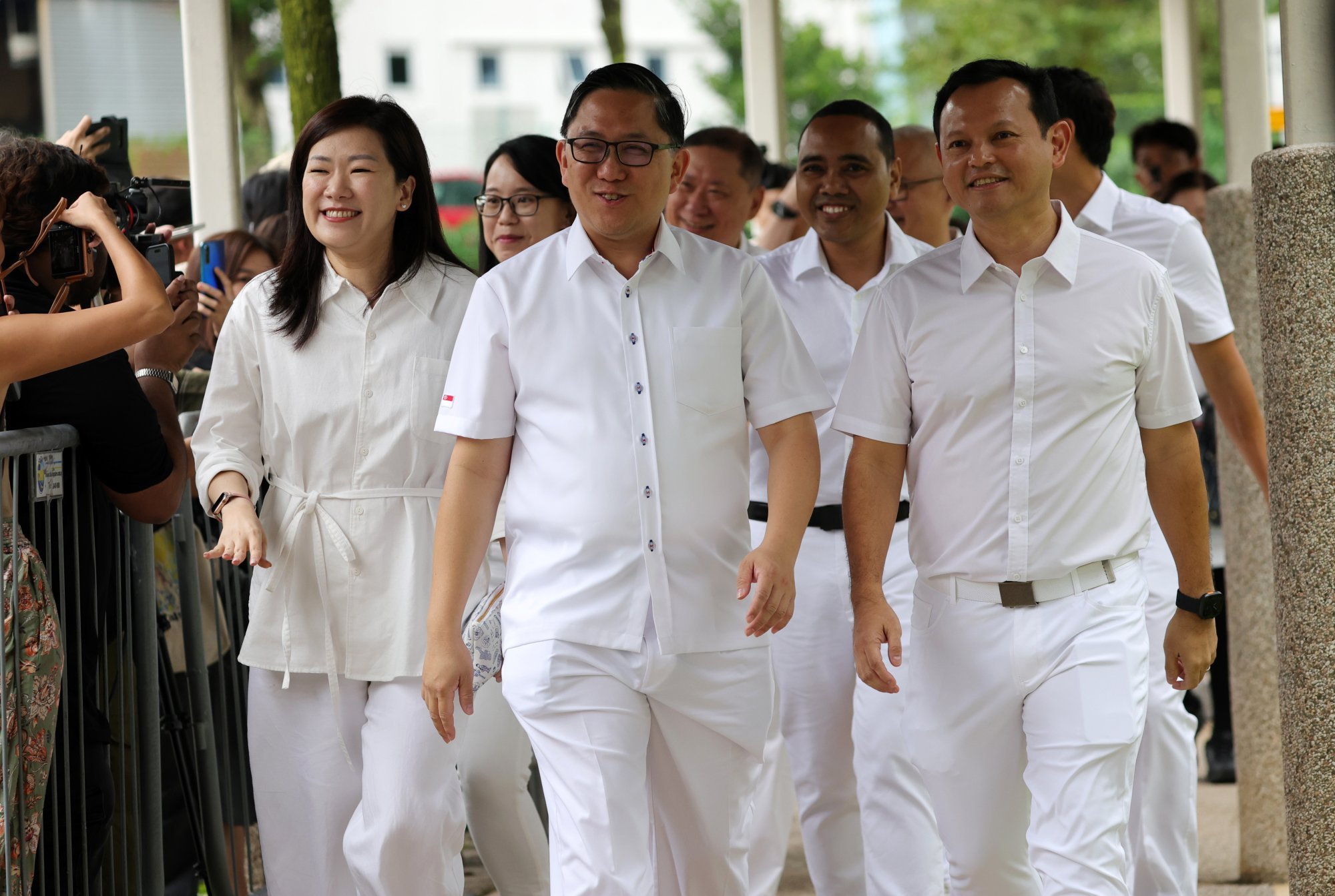 Zaqy Mohamad (right) and other PAP members arrive at a nomination centre in Singapore on April 23. Photo: EPA-EFE Zaqy Mohamad (right) and other PAP members arrive at a nomination centre in Singapore on April 23. Photo: EPA-EFE