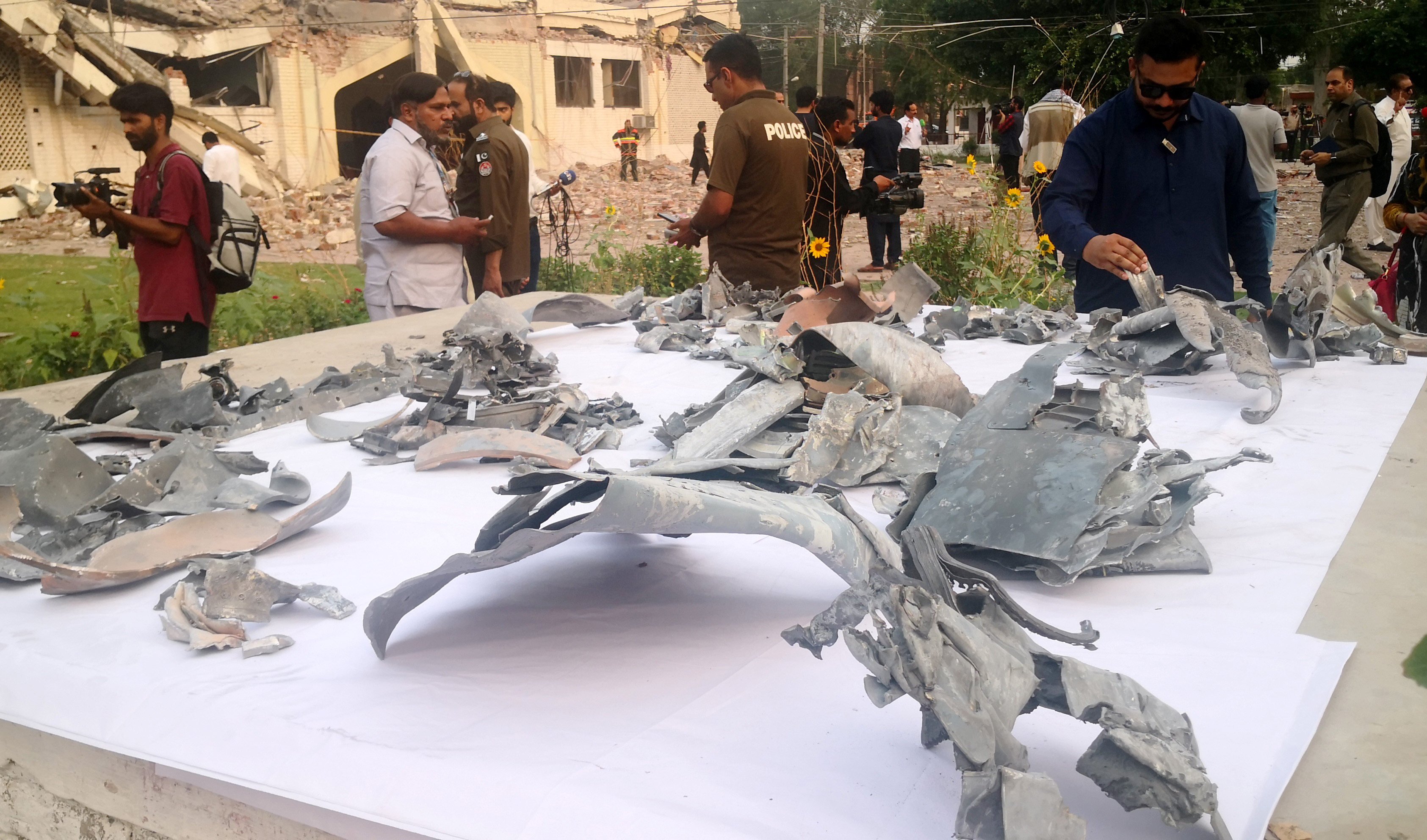 Fragments of Indian missiles are displayed near damaged buildings in Muridke, a town near Lahore, Pakistan, on Wednesday.  Photo: Xinhua
