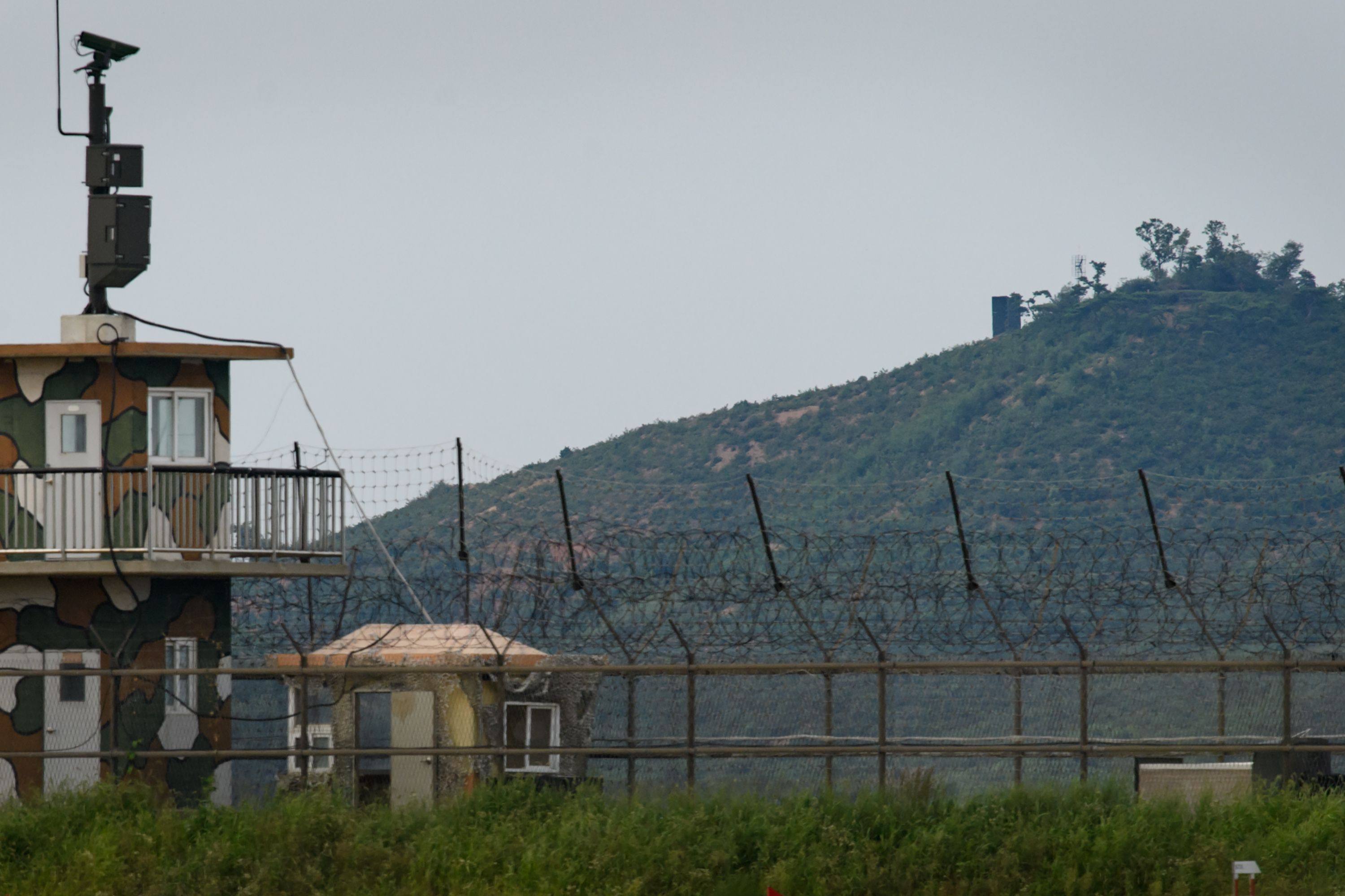 A North Korean propaganda speaker (top) is seen behind a South Korean military guard post (left) seen across the Demilitarised Zone separating the two countries. Photo: AFP