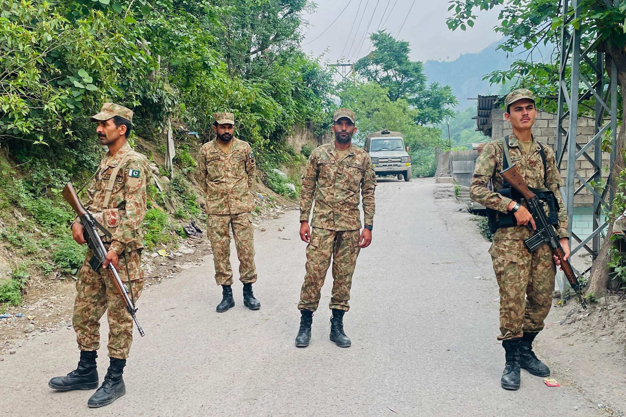Soldiers guard near a damaged mosque on Thursday, a day after Indian strikes in Muzaffarabad, the capital of Pakistan-administered Kashmir. Photo: AFP Soldiers guard near a damaged mosque on Thursday, a day after Indian strikes in Muzaffarabad, the capital of Pakistan-administered Kashmir. Photo: AFP