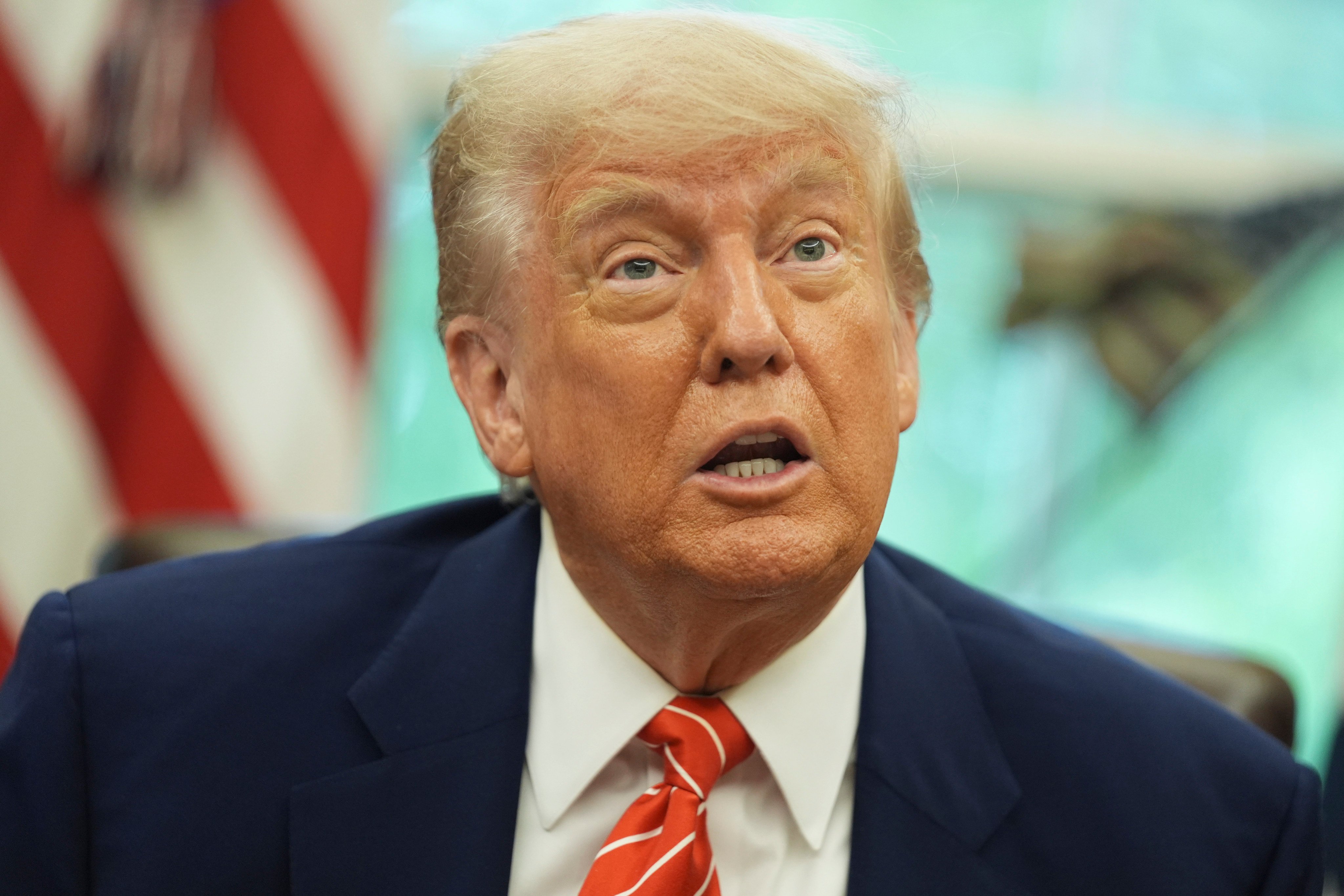 US President Donald Trump speaks with reporters after announcing a trade deal with Britain in the Oval Office of the White House on Thursday. Photo: AP