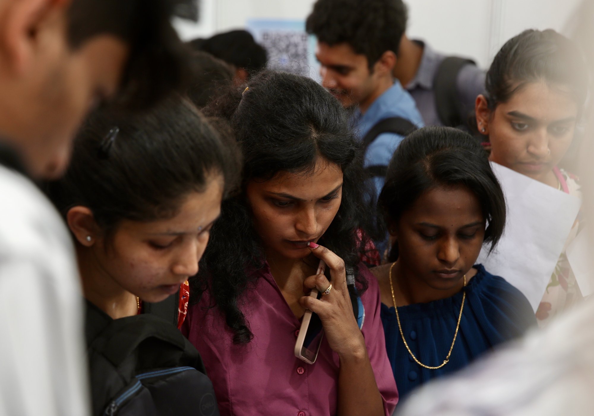 Jobseekers get information at exhibition stalls during a job fair in Bengaluru, India, in February 2024. Photo: EPA-EFE Jobseekers get information at exhibition stalls during a job fair in Bengaluru, India, in February 2024. Photo: EPA-EFE