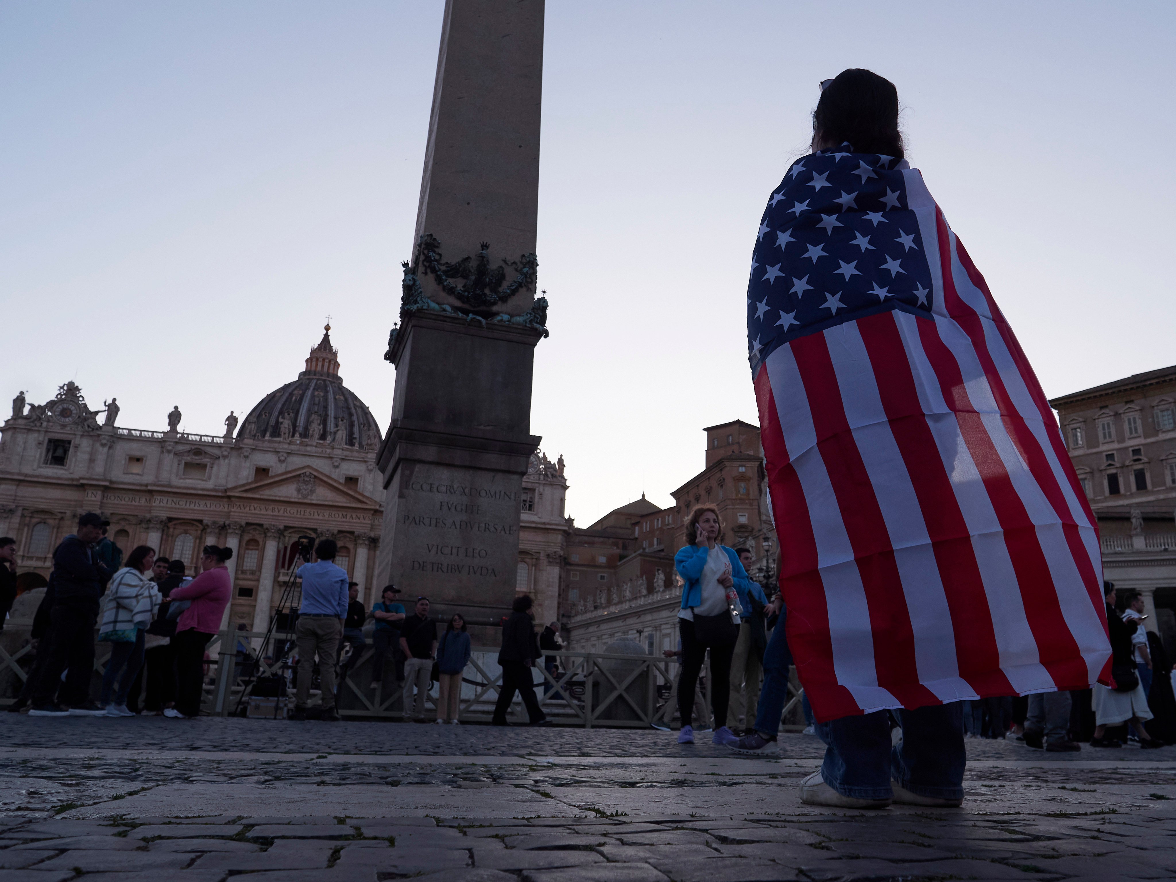 Andrea Gallardo from Texas wears an American flag after Pope Leo appeared on the balcony of St Peter’s Basilica at the Vatican. Photo: AP