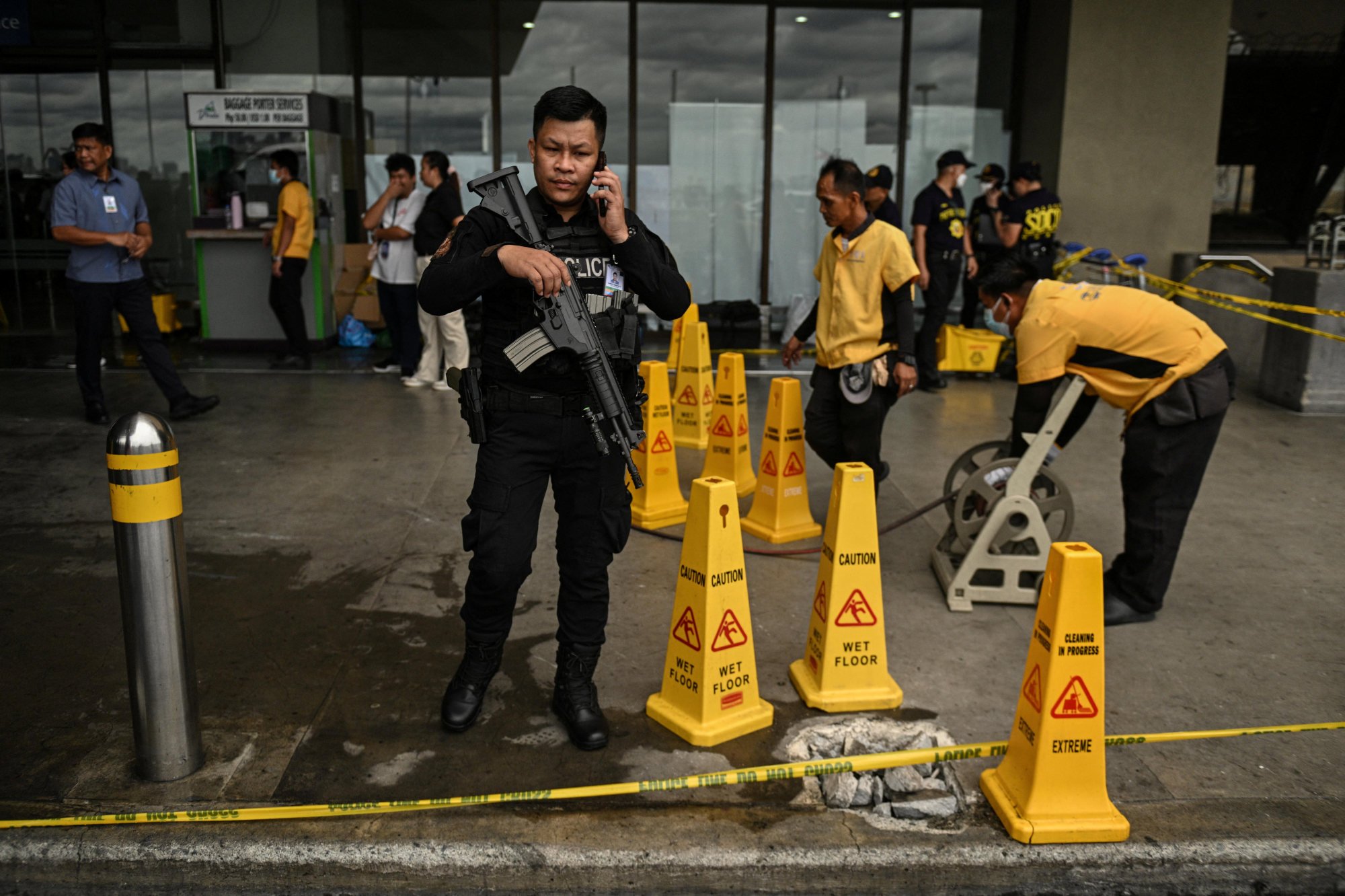 A policeman stands beside the damaged bollard after a vehicle crashed into the entrance of Ninoy Aquino International Airport Terminal 1 on May 4. Photo: Reuters A policeman stands beside the damaged bollard after a vehicle crashed into the entrance of Ninoy Aquino International Airport Terminal 1 on May 4. Photo: Reuters