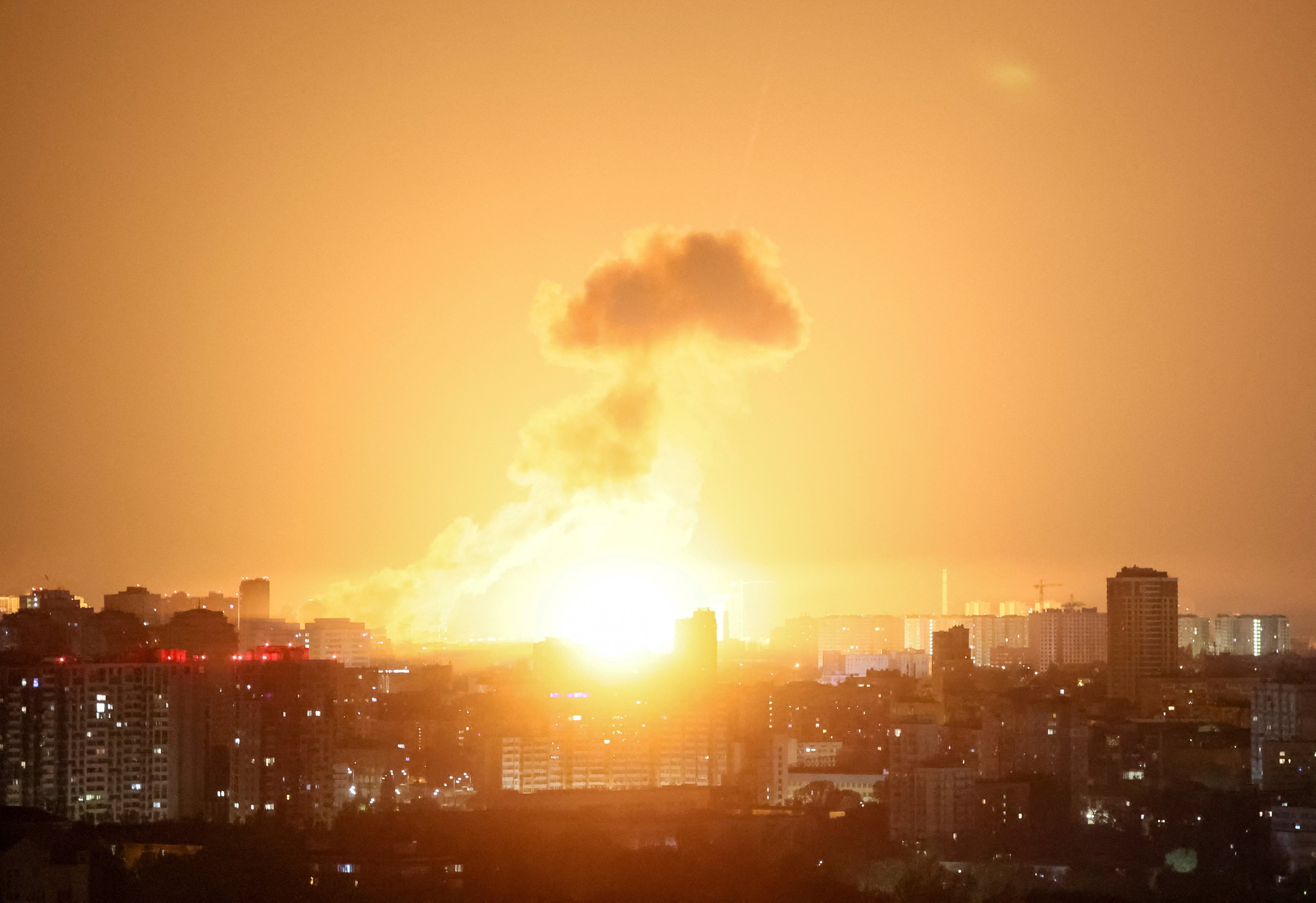 An explosion lights up the sky over Kyiv during a Russian missile and drone strike in Ukraine in April. Photo: Reuters