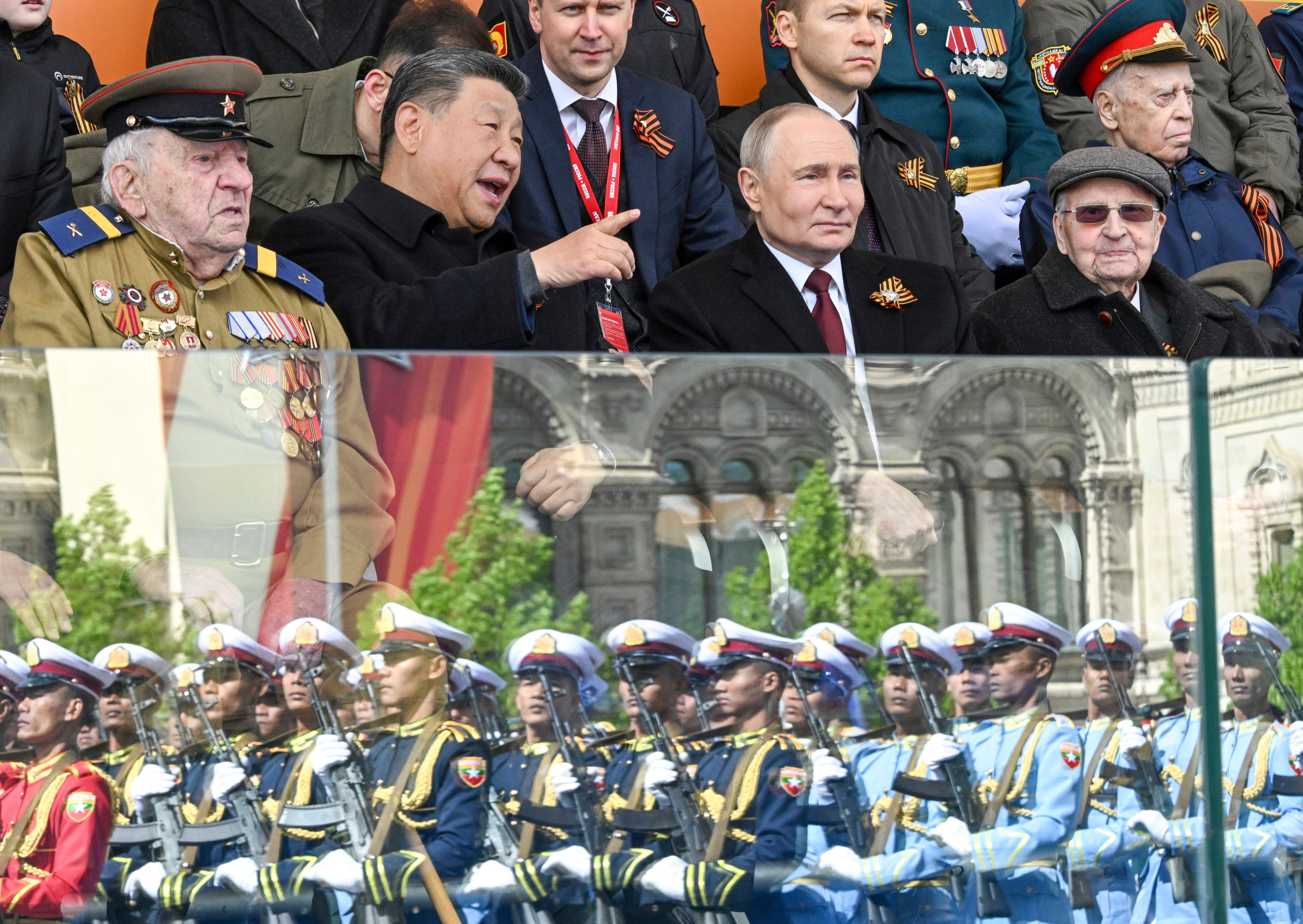 Chinese President Xi Jinping and Russian President Vladimir Putin watch the parade in Moscow. Photo: RIA Novosti via AP