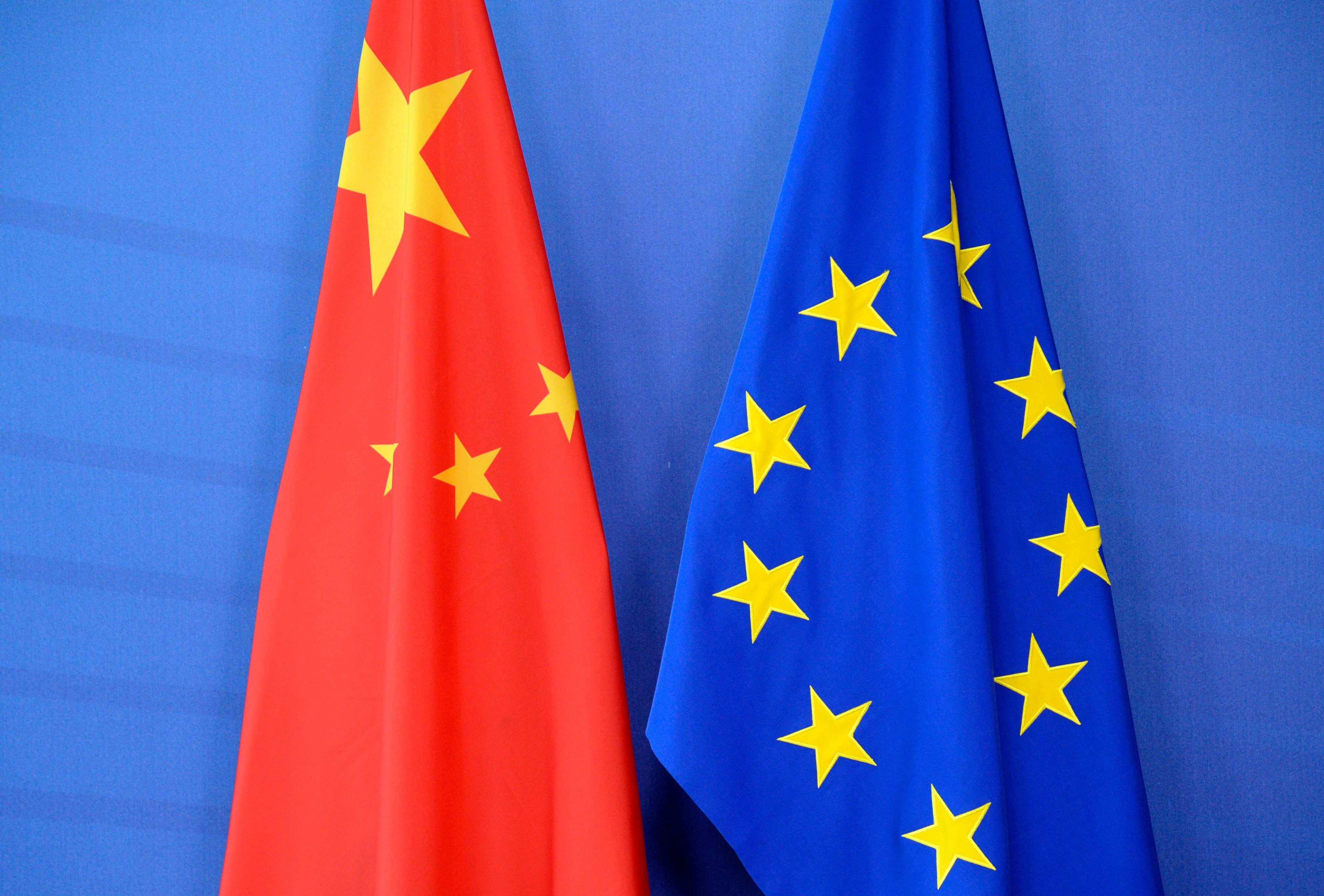 The Chinese and European Union flags side by side at a summit in Brussels. Photo: AFP