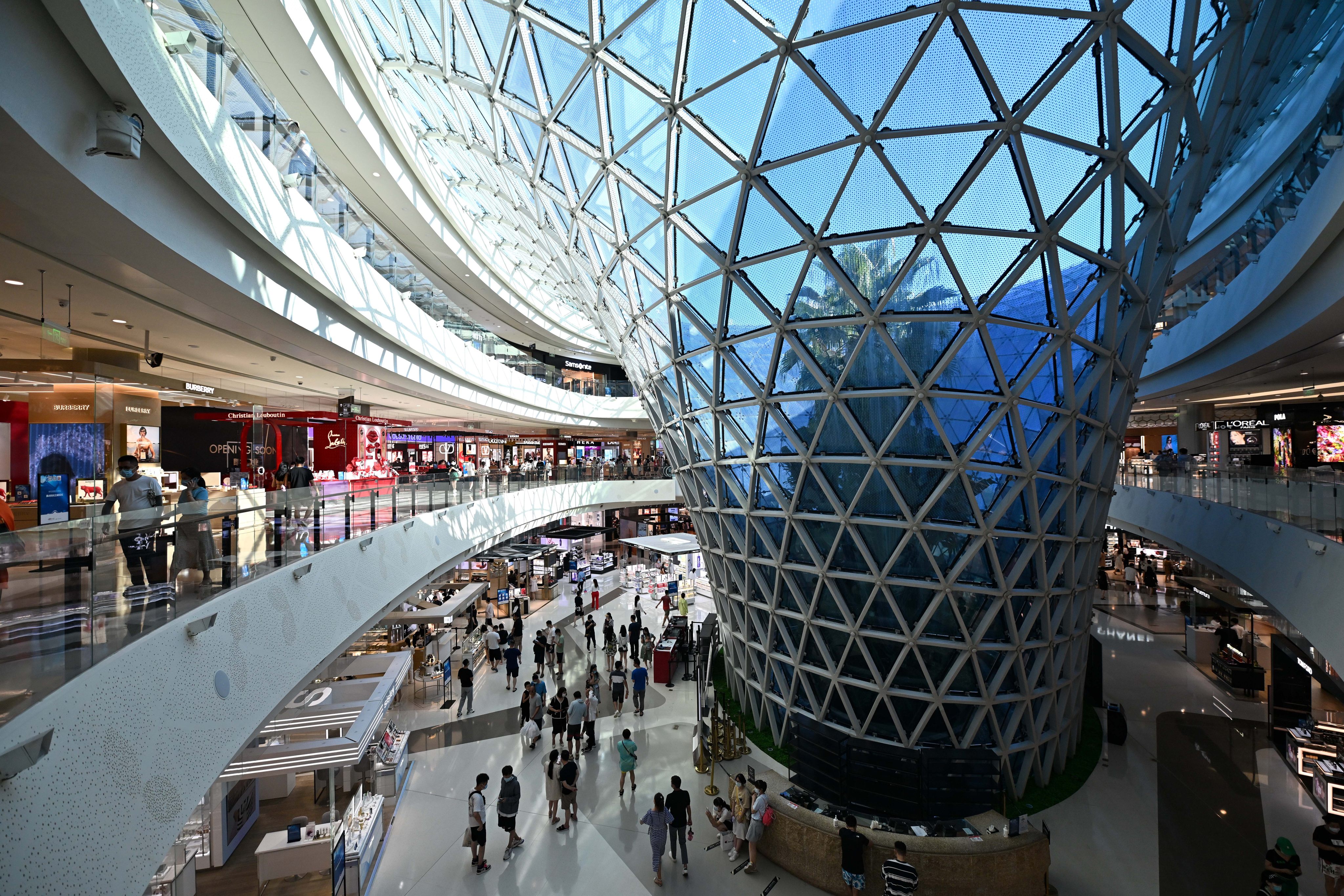 Shoppers browse an international duty-free mall in Sanya, Hainan province. The island’s duty-free stores are expected to attract more customers amid the trade war with the United States. Photo: Xinhua
