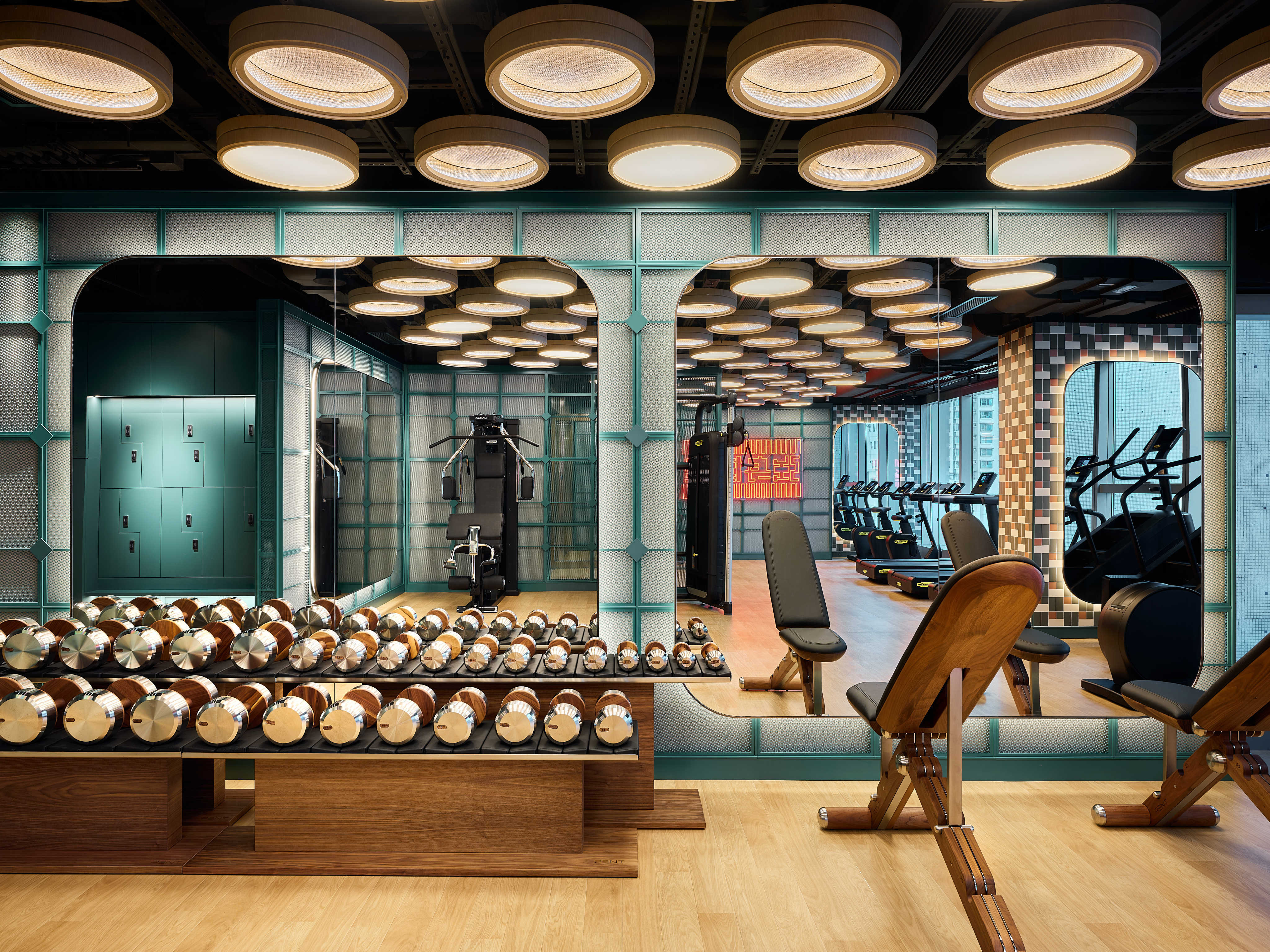 Bamboo steam baskets make light fixtures in the gym at One Bedford Place, Tai Kok Tsui. Photo: Han Tang