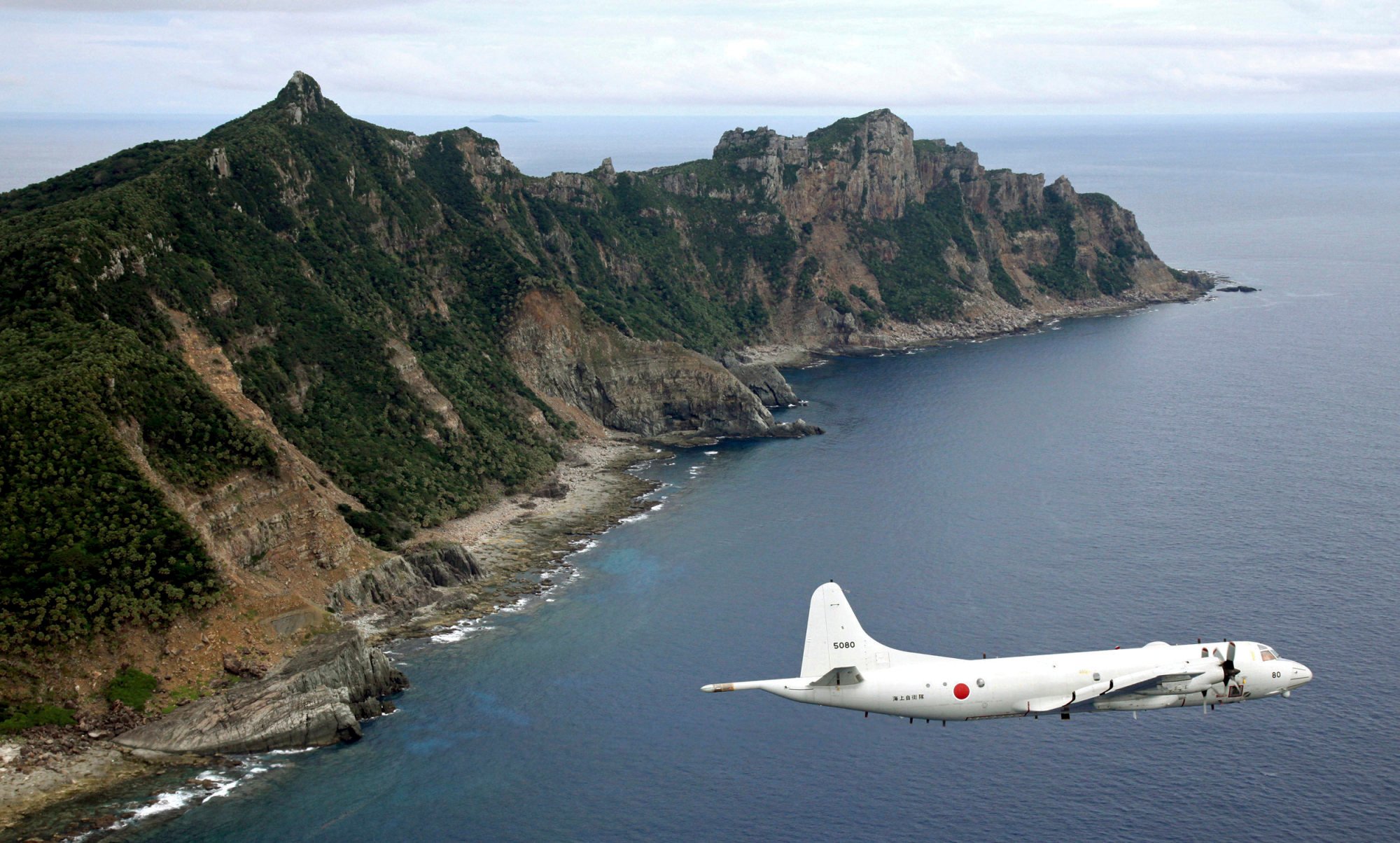 A Japanese surveillance plane flies over the disputed islands called Diaoyu in China and Senkaku in Japan. The Japanese military is facing a manpower crunch. Photo: AP A Japanese surveillance plane flies over the disputed islands called Diaoyu in China and Senkaku in Japan. The Japanese military is facing a manpower crunch. Photo: AP