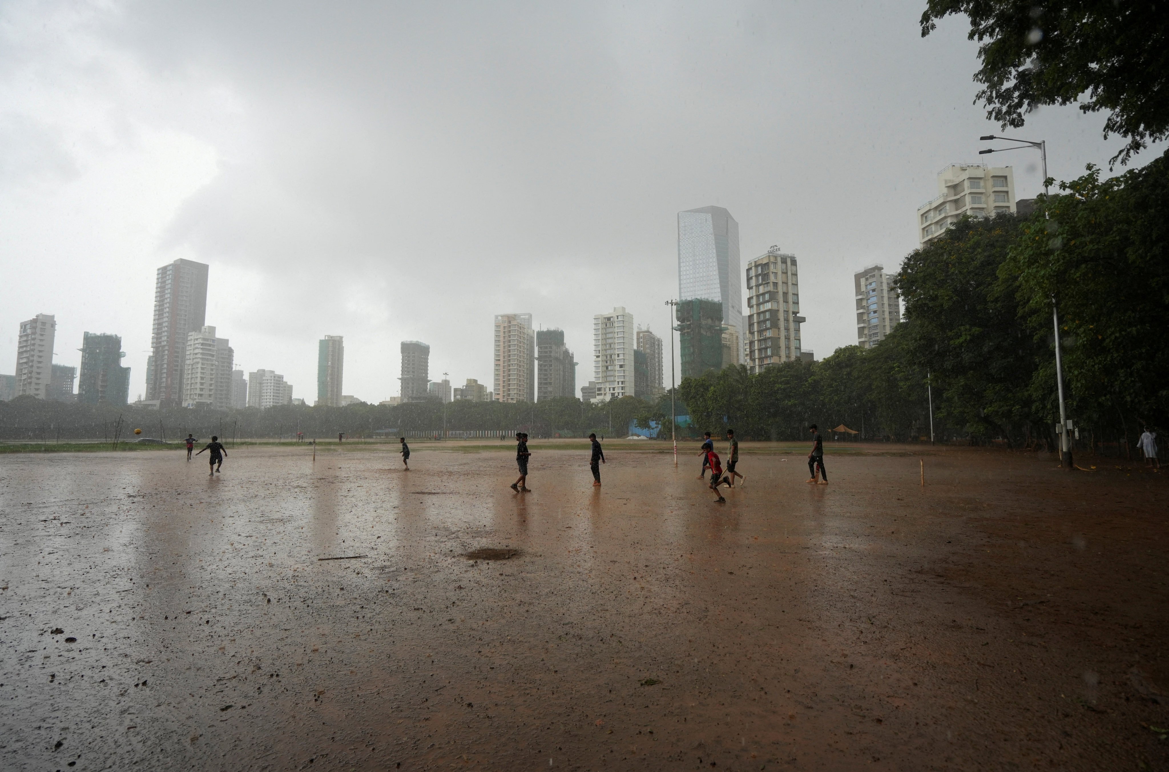 Children play in the rain in Mumbai in June last year. Photo: Reuters