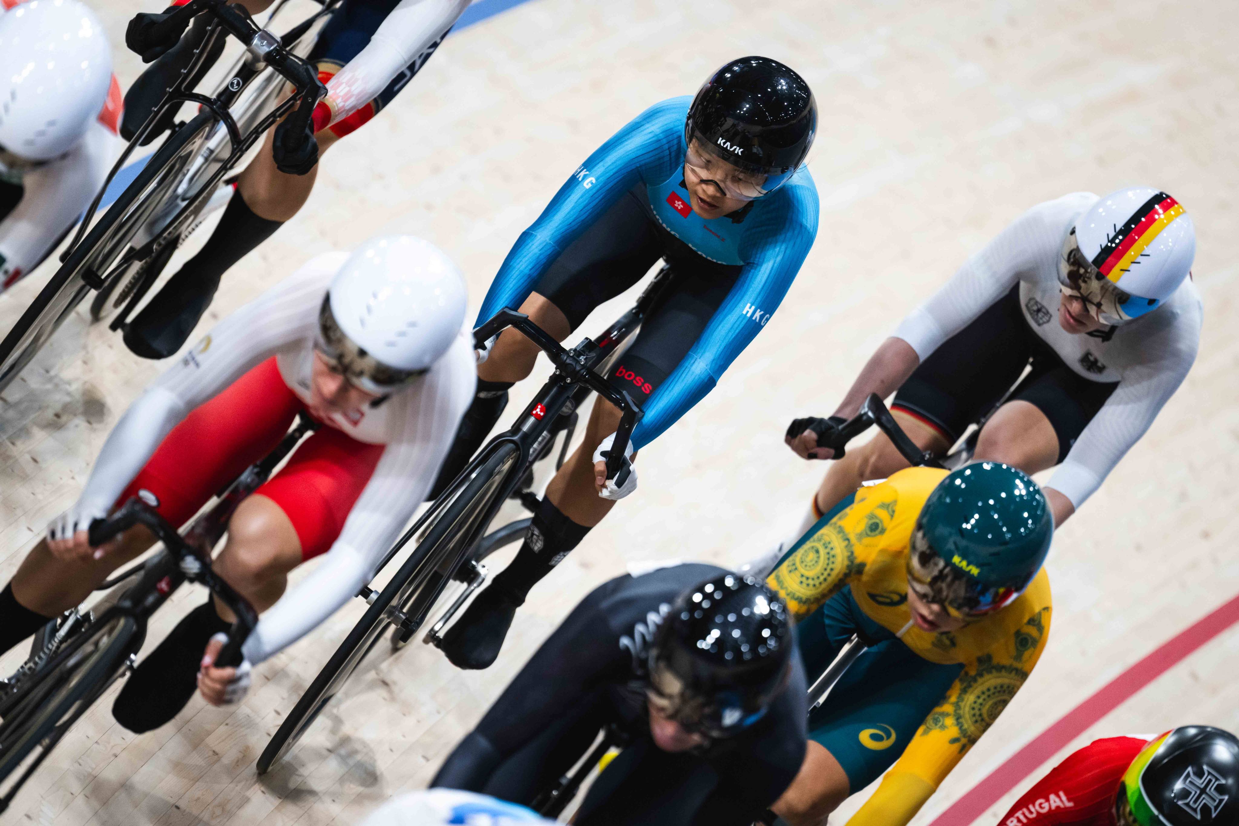 Hong Kong cyclist Ceci Lee (centre, blue top) rides in the omnium elimination race at the Paris Olympics. Photo: SF&OC