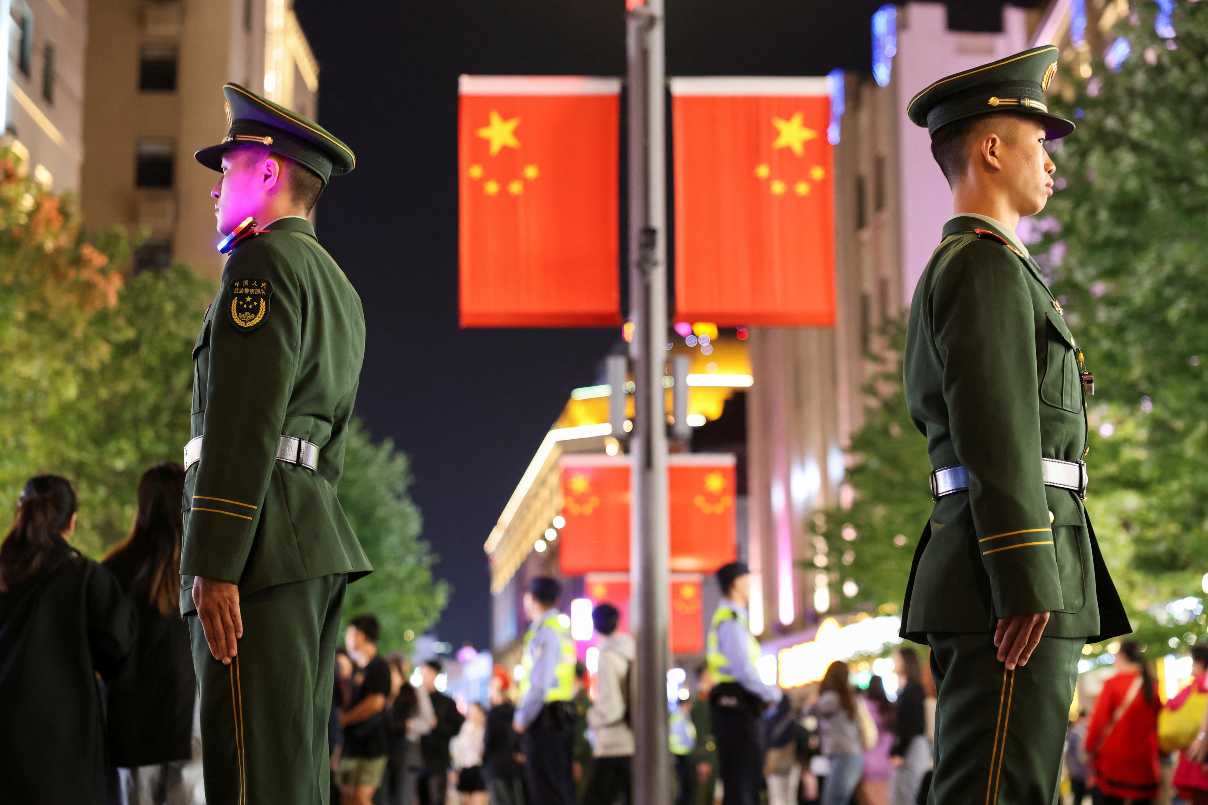 Police officers stand guard on Shanghai’s Nanjing Road on Monday. A top security official has ordered China’s law enforcement agencies to swear “absolute loyalty” to the Communist Party. Photo: Reuters