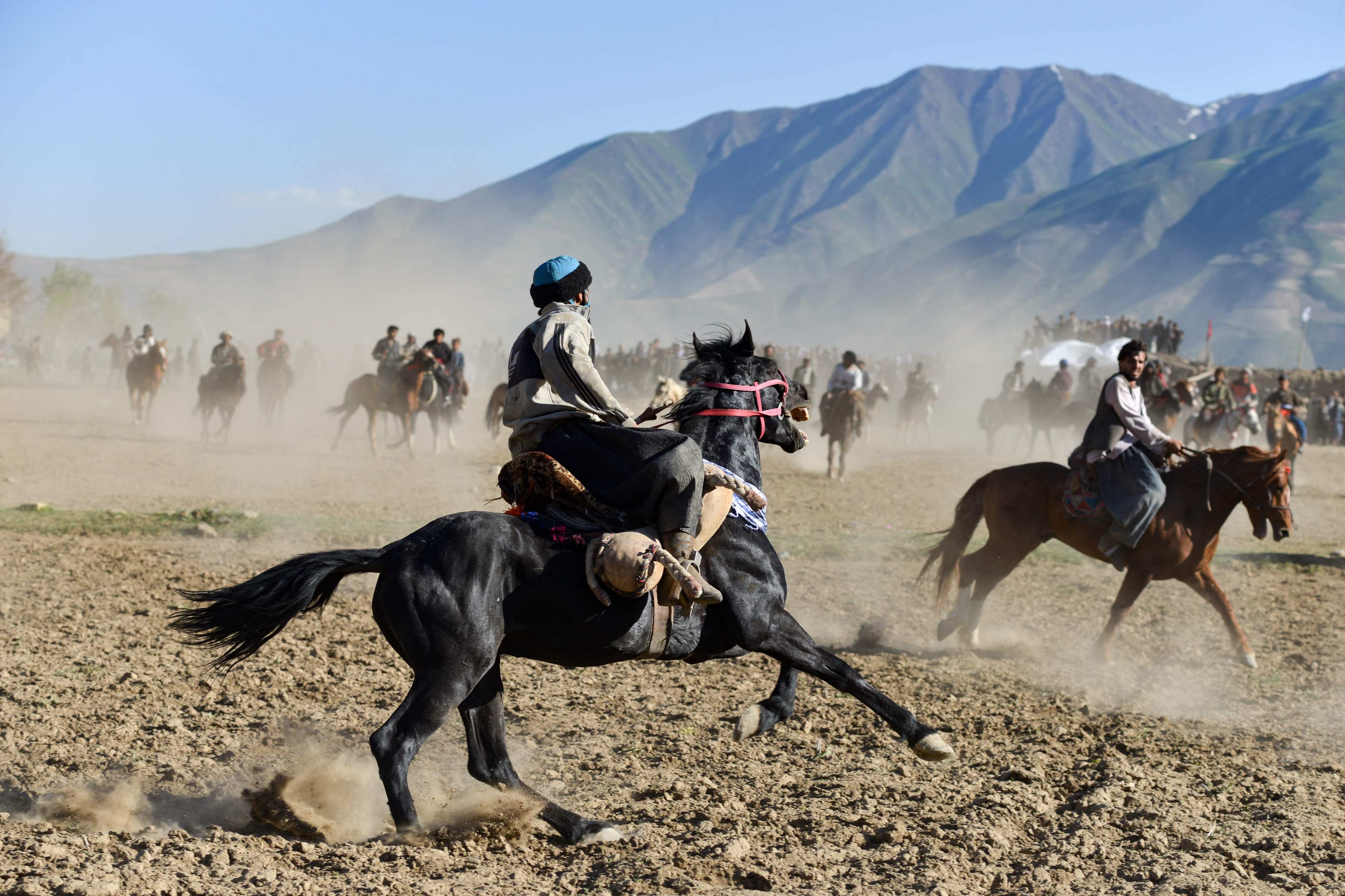 Afghan horse riders compete in buzkashi, a Central Asian sport, at a field in Khash District of Badakhshan Province, Afghanistan, on April 29, 2025. Buzkashi consists horse-mounted players attempting to put a goat or calf carcass in a goal. Photo: AFP