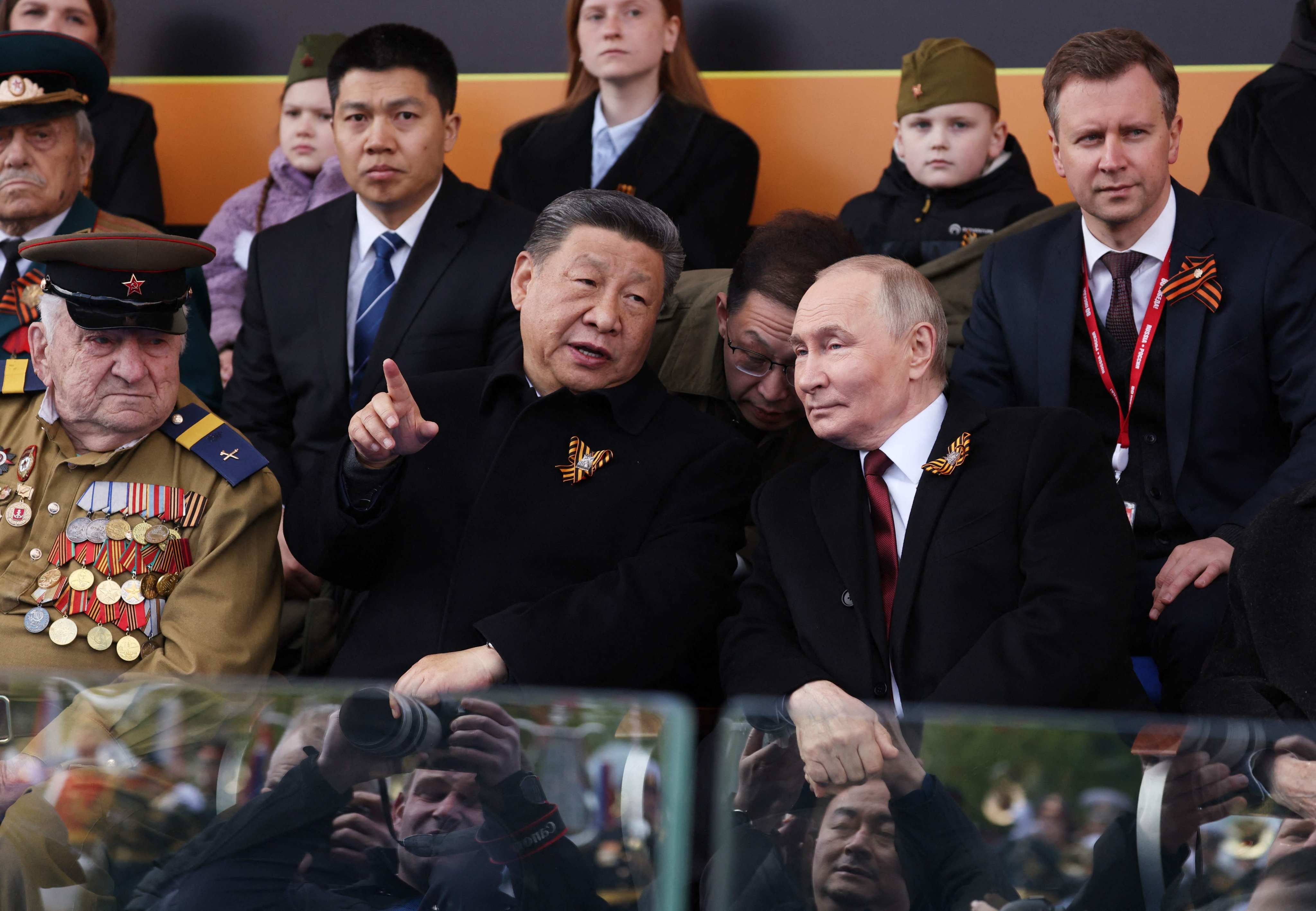 Russian President Vladimir Putin and Chinese President Xi Jinping attend the Victory Day military parade on Red Square in Moscow on May 9. Photo: Pool/AFP