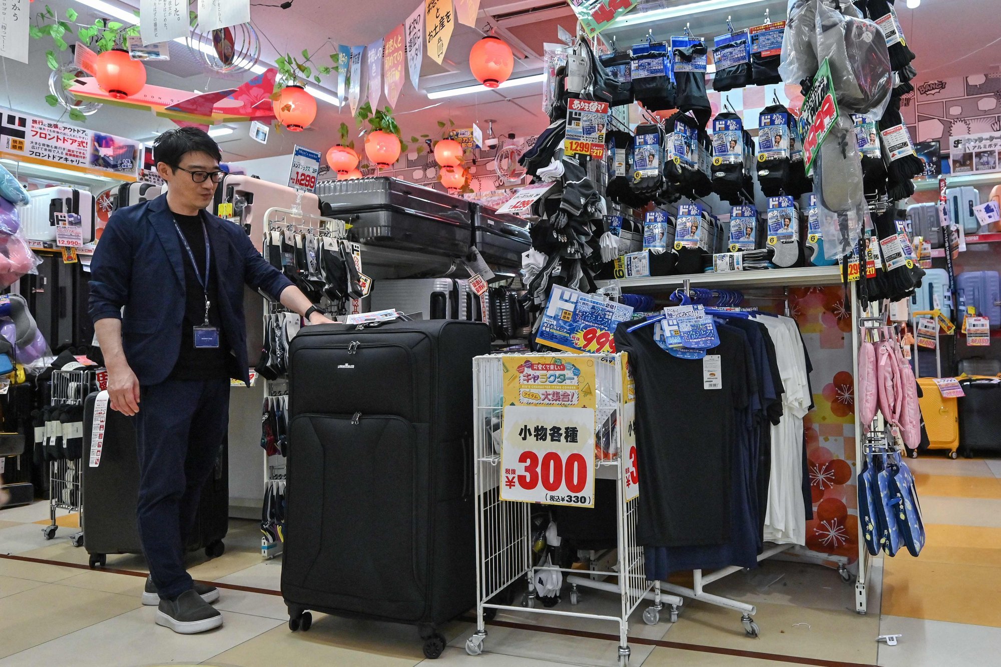 Store manager Motoki Hara at a Don Quijote outlet in Tokyo. Photo: AFP Store manager Motoki Hara at a Don Quijote outlet in Tokyo. Photo: AFP