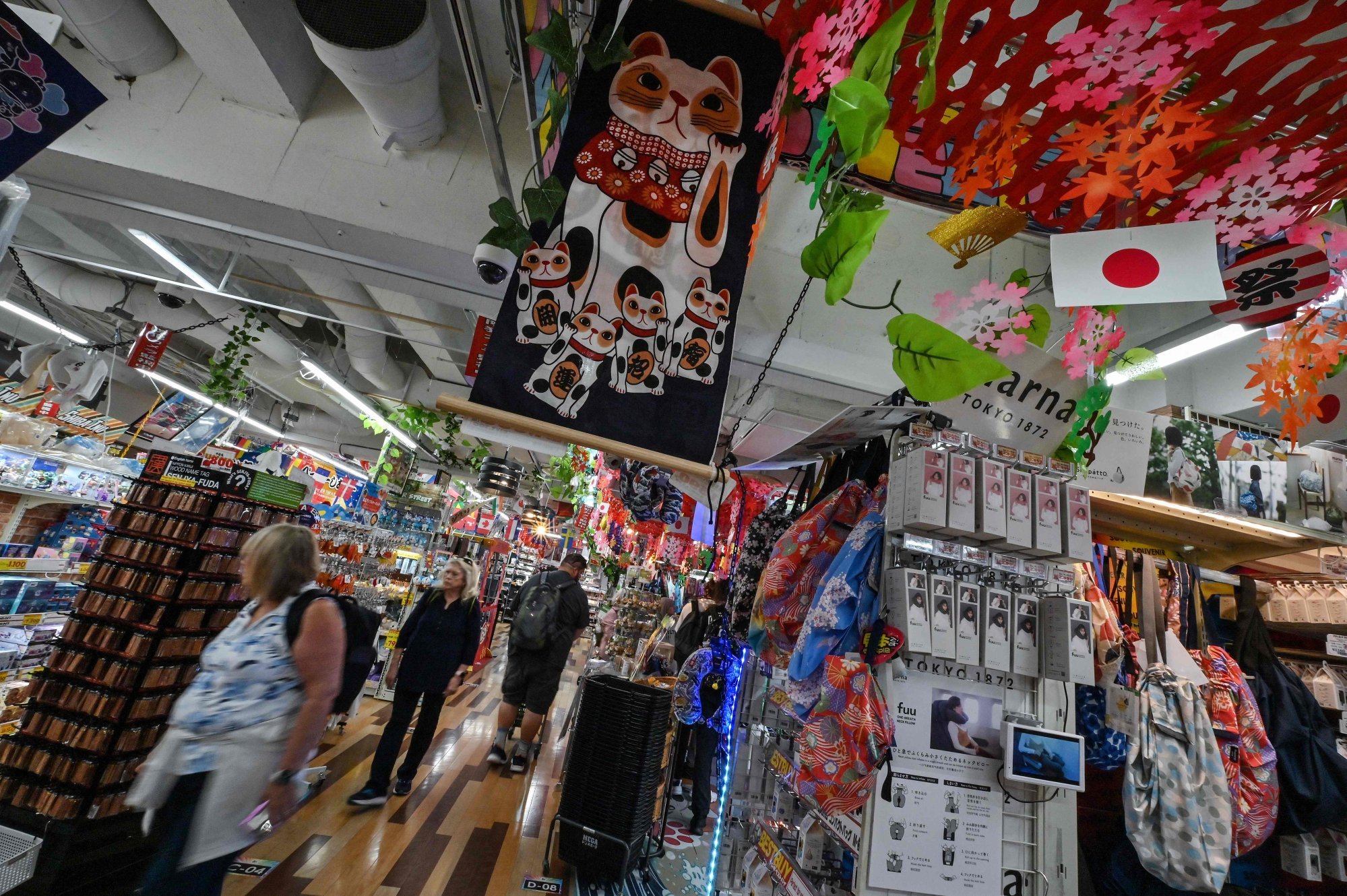 Customers visit a Don Quijote branch in Tokyo. Photo: AFP Customers visit a Don Quijote branch in Tokyo. Photo: AFP