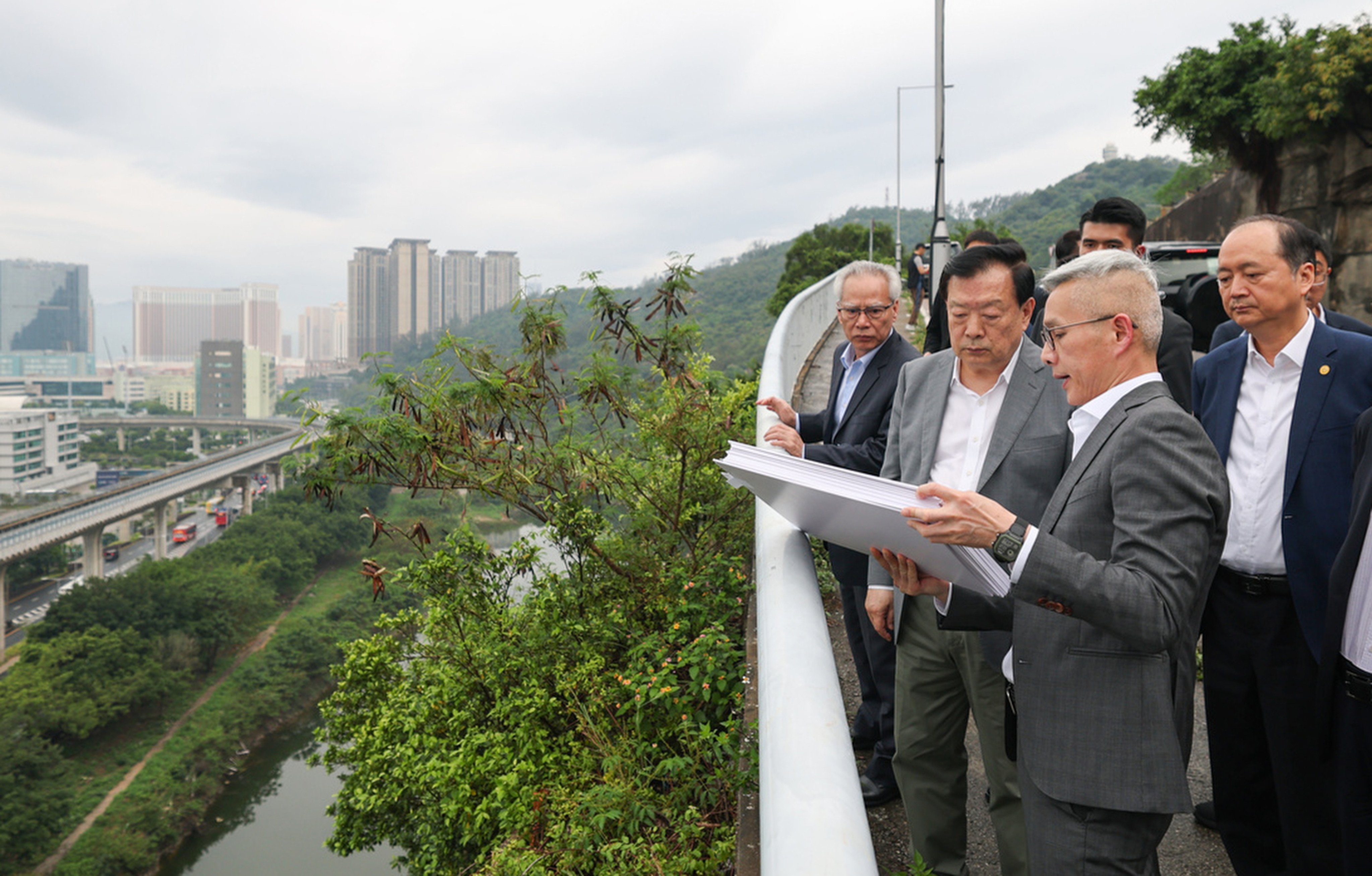 Hong Kong and Macau Affairs Office Director Xia Baolong (second left) and city leader Sam Hou-fai (left) inspect a site earmarked for development. Photo: Handout