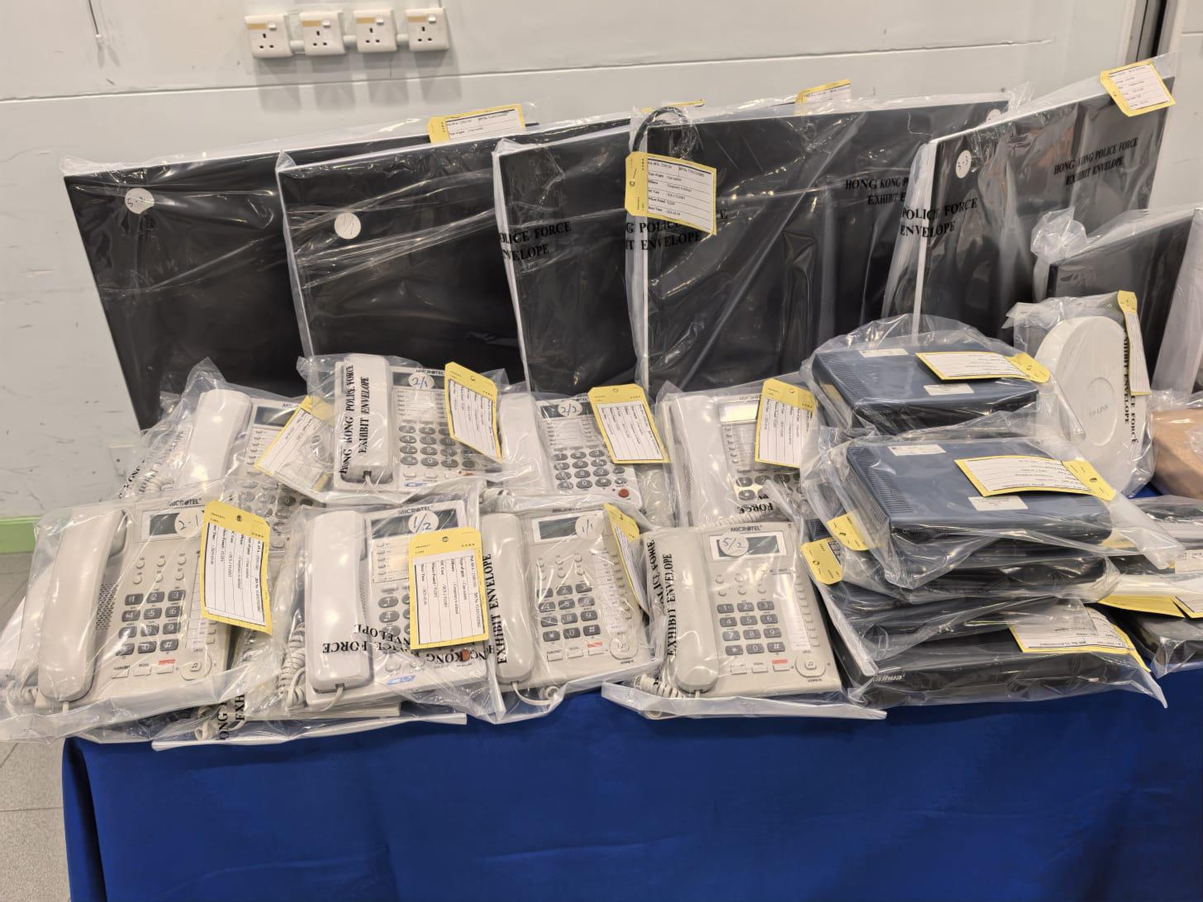 Police seized phones, computers, smartphones, scripts, investment contracts, principal receipts and falsified investment records. Photo: SCMP