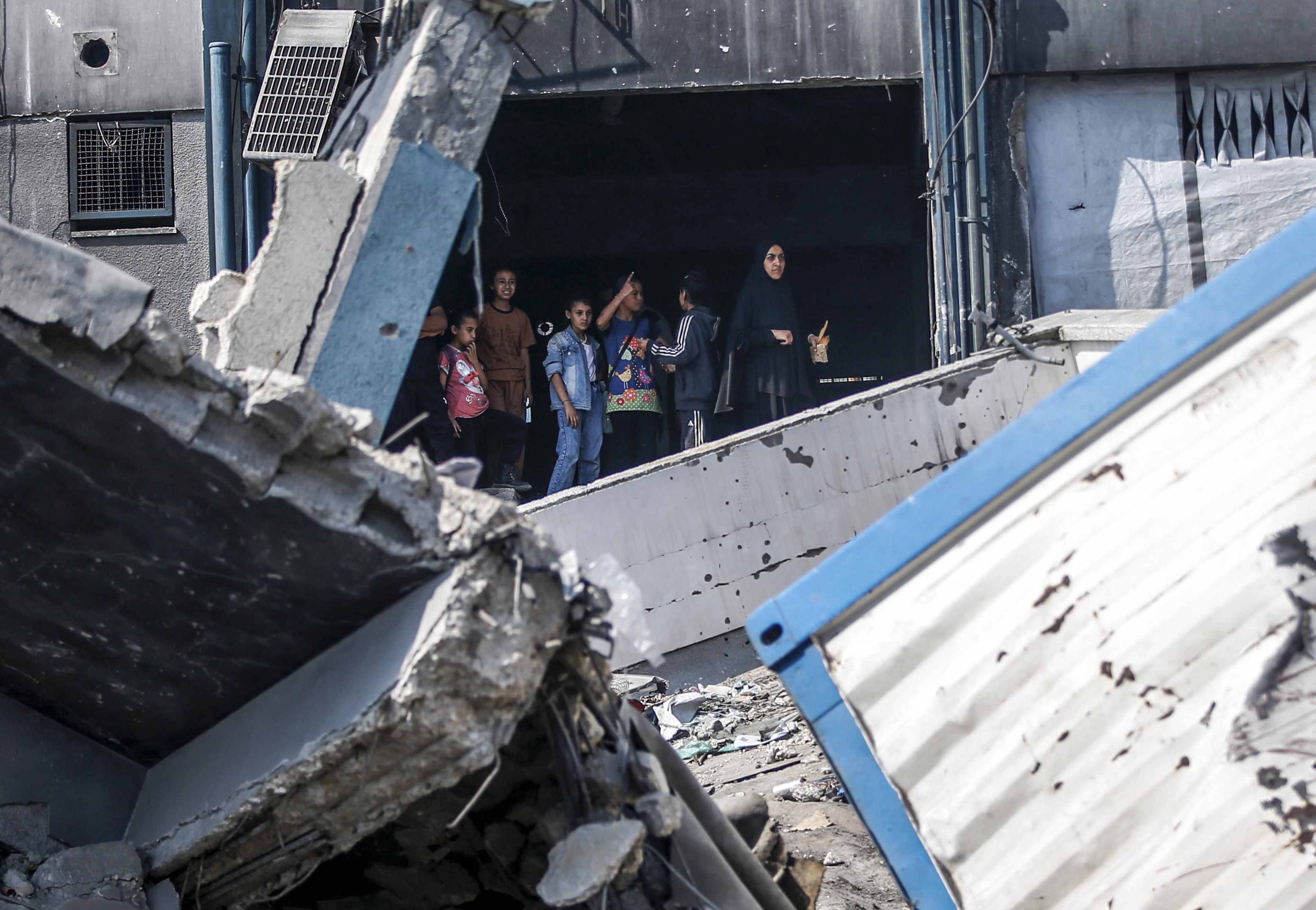 Palestinians are seen at the site of an aid distribution center following an Israeli airstrike in Gaza City, on Saturday. Photo: Xinhua