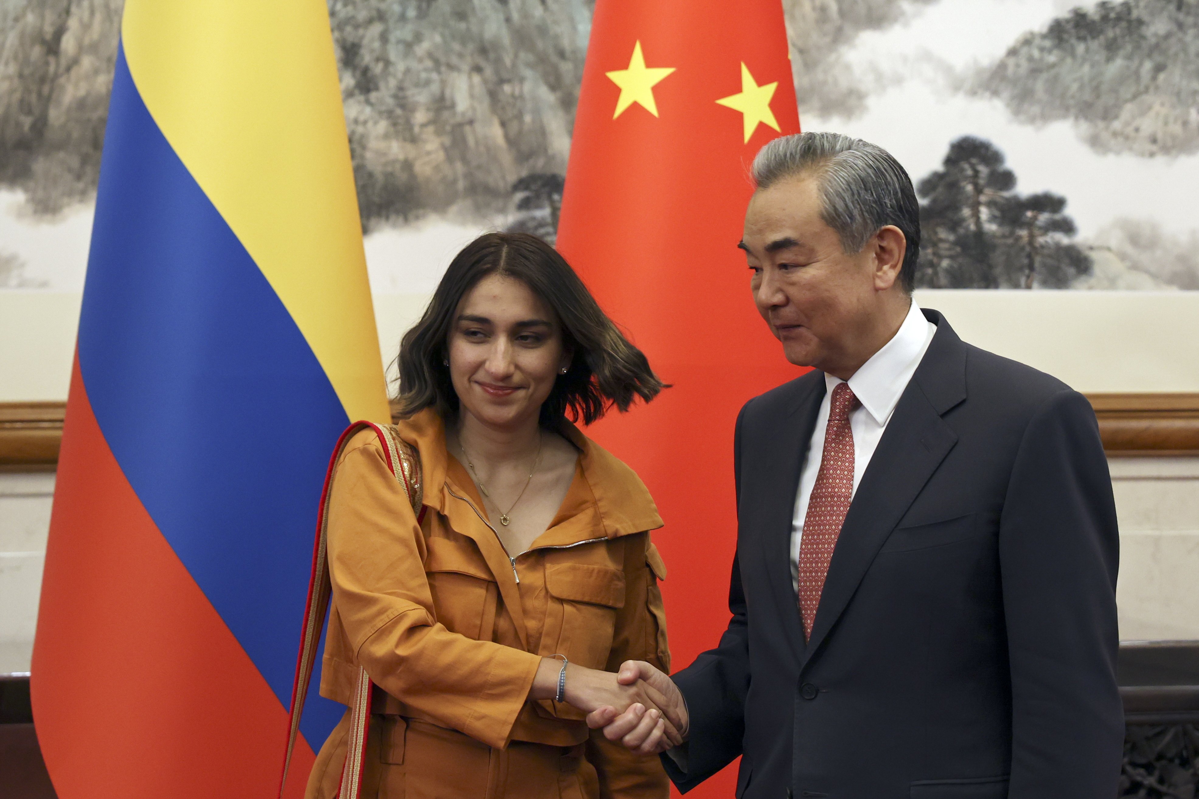 Chinese Foreign Minister Wang Yi and Colombia’s Foreign Minister Laura Sarabia shake hands before their meeting in Beijing, China on Monday. Photo: EPA-EFE