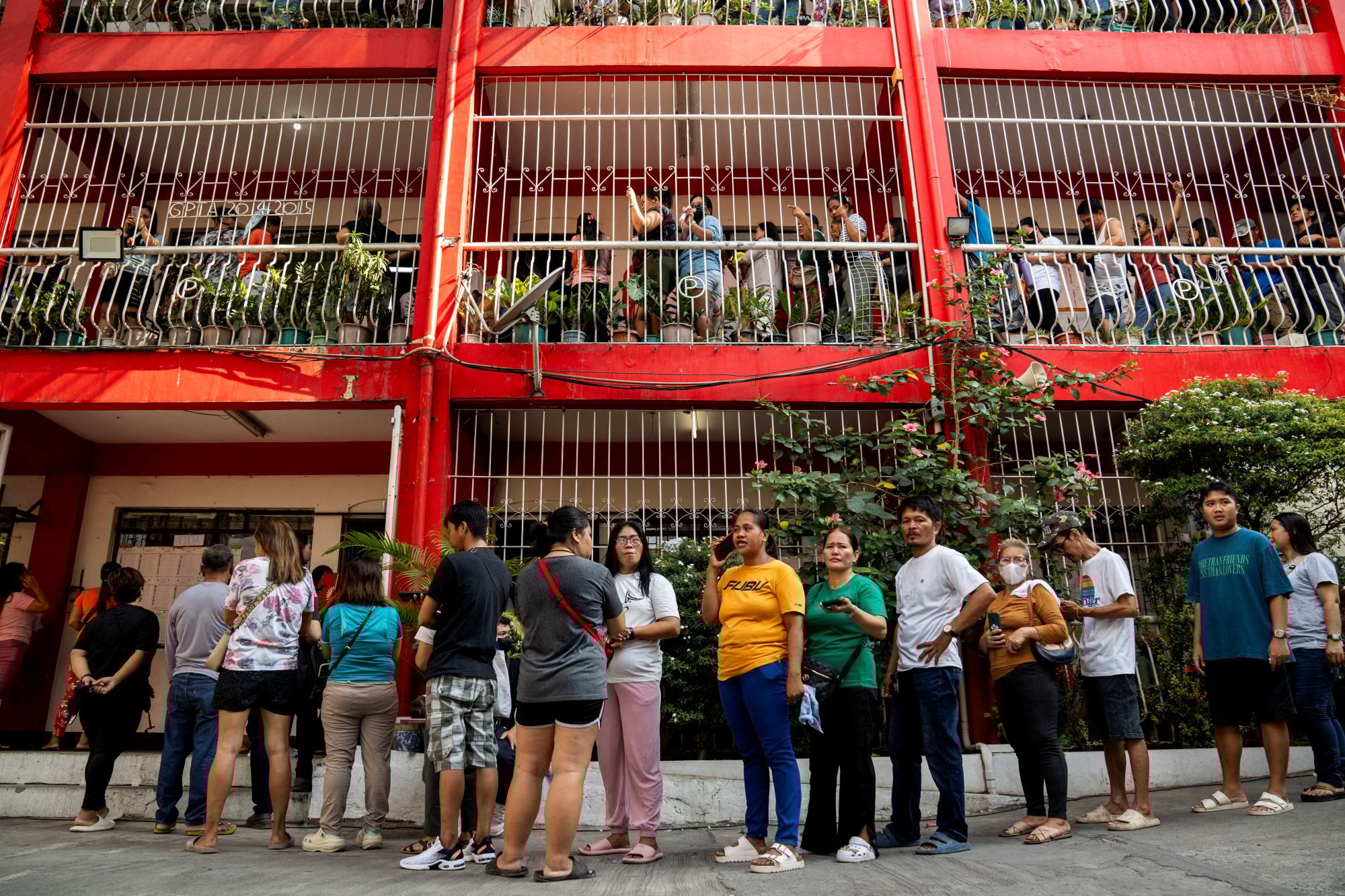 Filipinos queue at a polling station in Taguig City, Metro Manila, to vote in the midterm elections on Monday. Photo: Reuters Filipinos queue at a polling station in Taguig City, Metro Manila, to vote in the midterm elections on Monday. Photo: Reuters