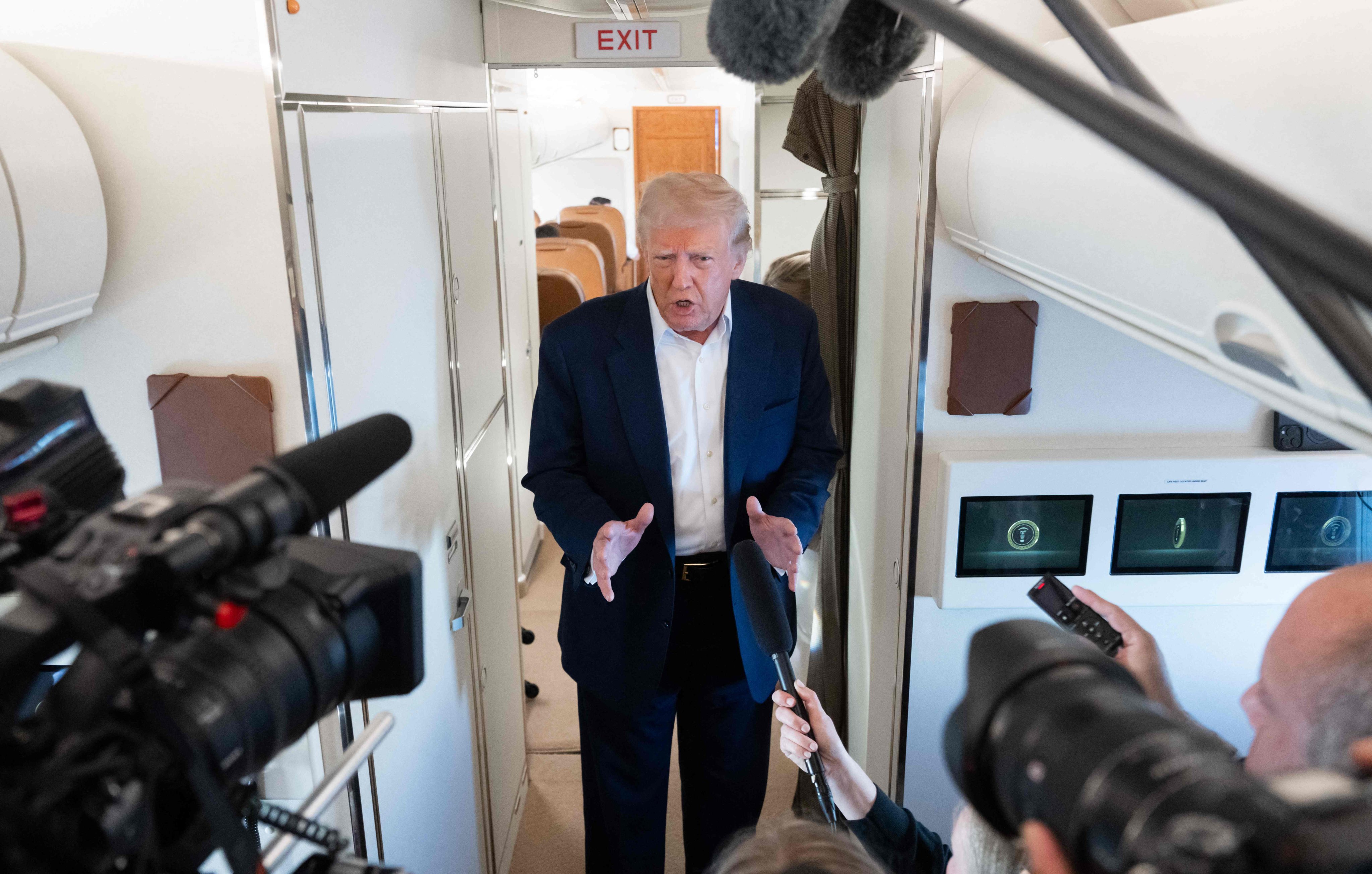 US President Donald Trump speaks to the media aboard Air Force One. Photo: AFP