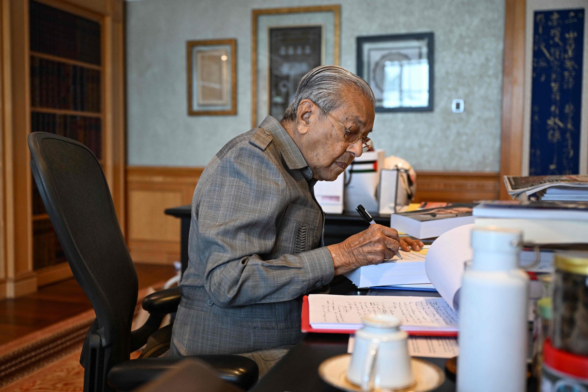 Malaysia’s former prime minister Mahathir Mohamad working at his office in Putrajaya. Photo: AFP Malaysia’s former prime minister Mahathir Mohamad working at his office in Putrajaya. Photo: AFP
