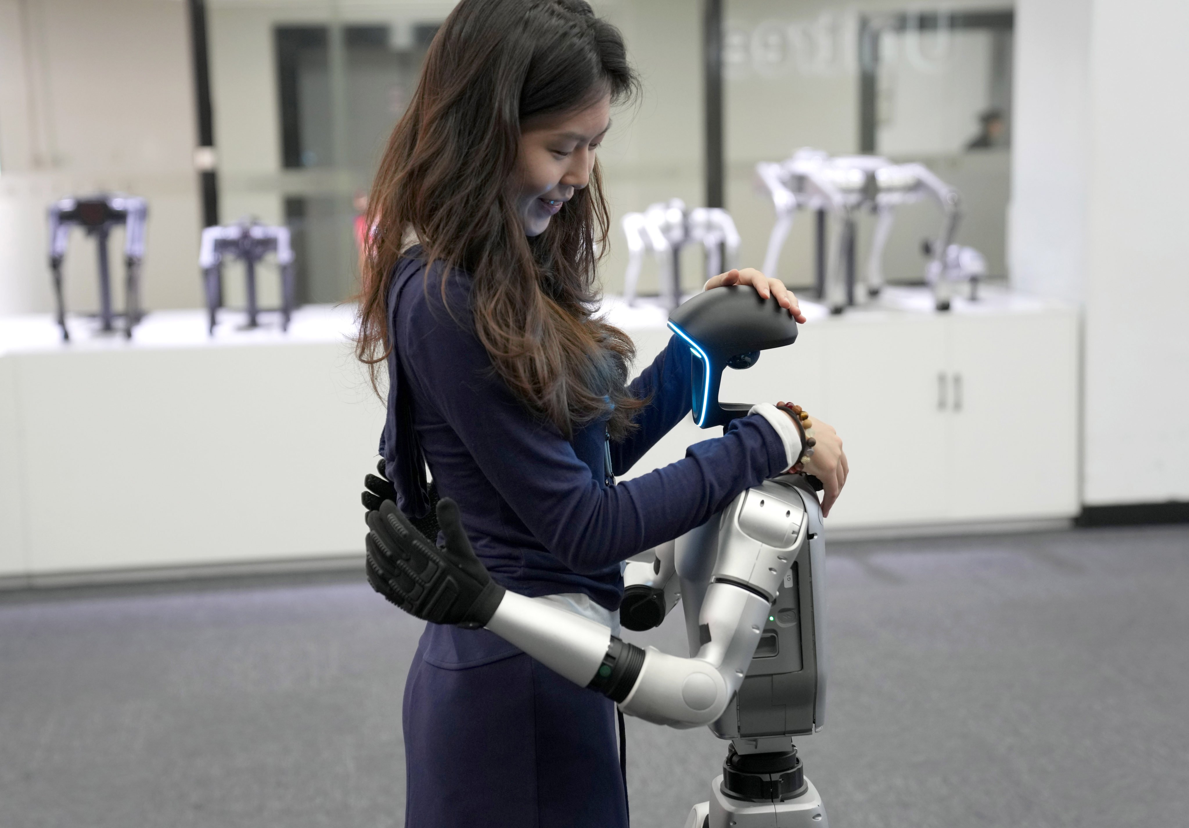The G1 humanoid robot model from Unitree Robotics gives a hug at the firm’s exhibition hall in Hangzhou, capital of eastern Zhejiang province, on April 23, 2025. Photo: Xinhua