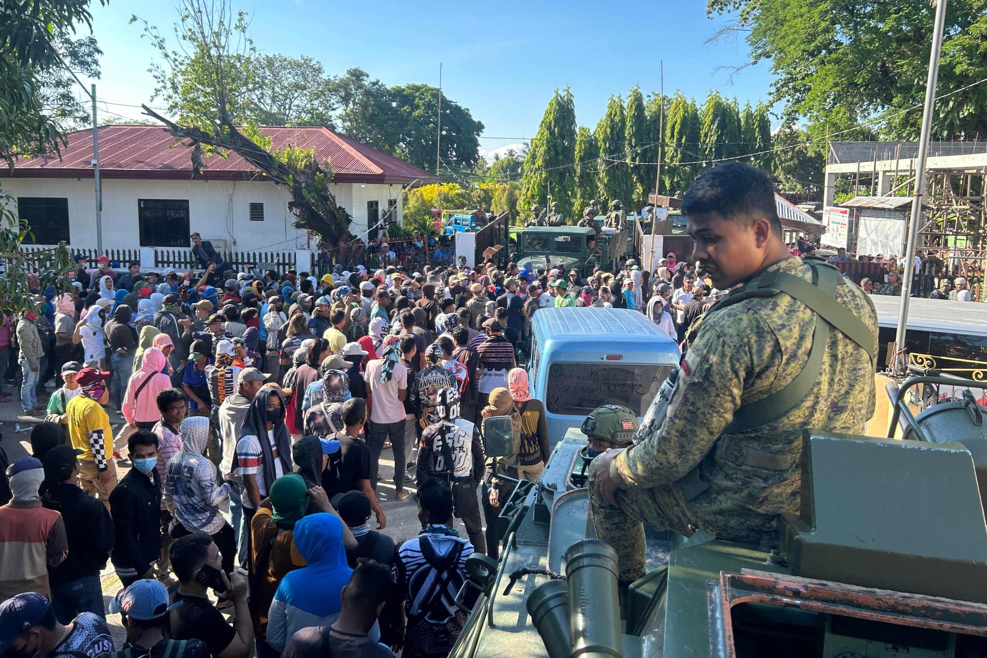 Supporters of the United Bangsamoro Justice Party block military vehicles transporting election material from leaving the Datu Odin Sinsuat municipal hall to nearby polling centres on Monday. Photo: AFP Supporters of the United Bangsamoro Justice Party block military vehicles transporting election material from leaving the Datu Odin Sinsuat municipal hall to nearby polling centres on Monday. Photo: AFP