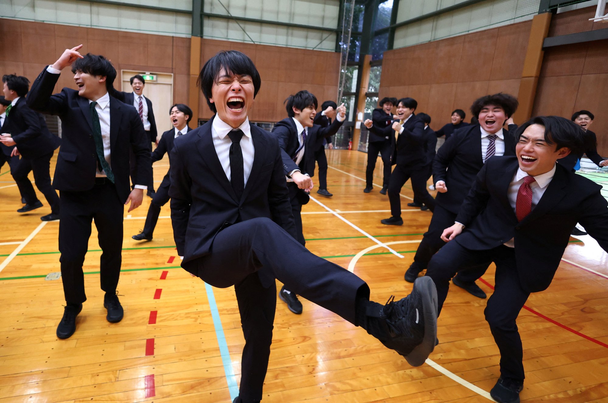 Satoi Mochizuki, 32, laughs with his Cheer Re-Man’s teammates as they practice at a gym in Tokyo. Photo: Reuters Satoi Mochizuki, 32, laughs with his Cheer Re-Man’s teammates as they practice at a gym in Tokyo. Photo: Reuters
