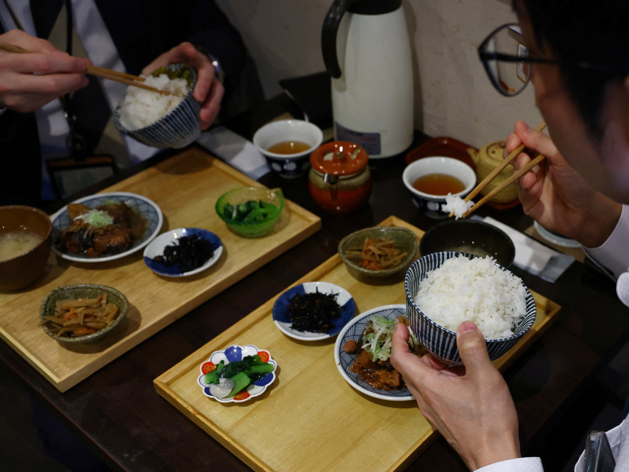 Customers eating California-grown rice at a restaurant in Tokyo. Rice producer Japan also imports rice from countries such as the US and South Korea. Photo: Reuters Customers eating California-grown rice at a restaurant in Tokyo. Rice producer Japan also imports rice from countries such as the US and South Korea. Photo: Reuters