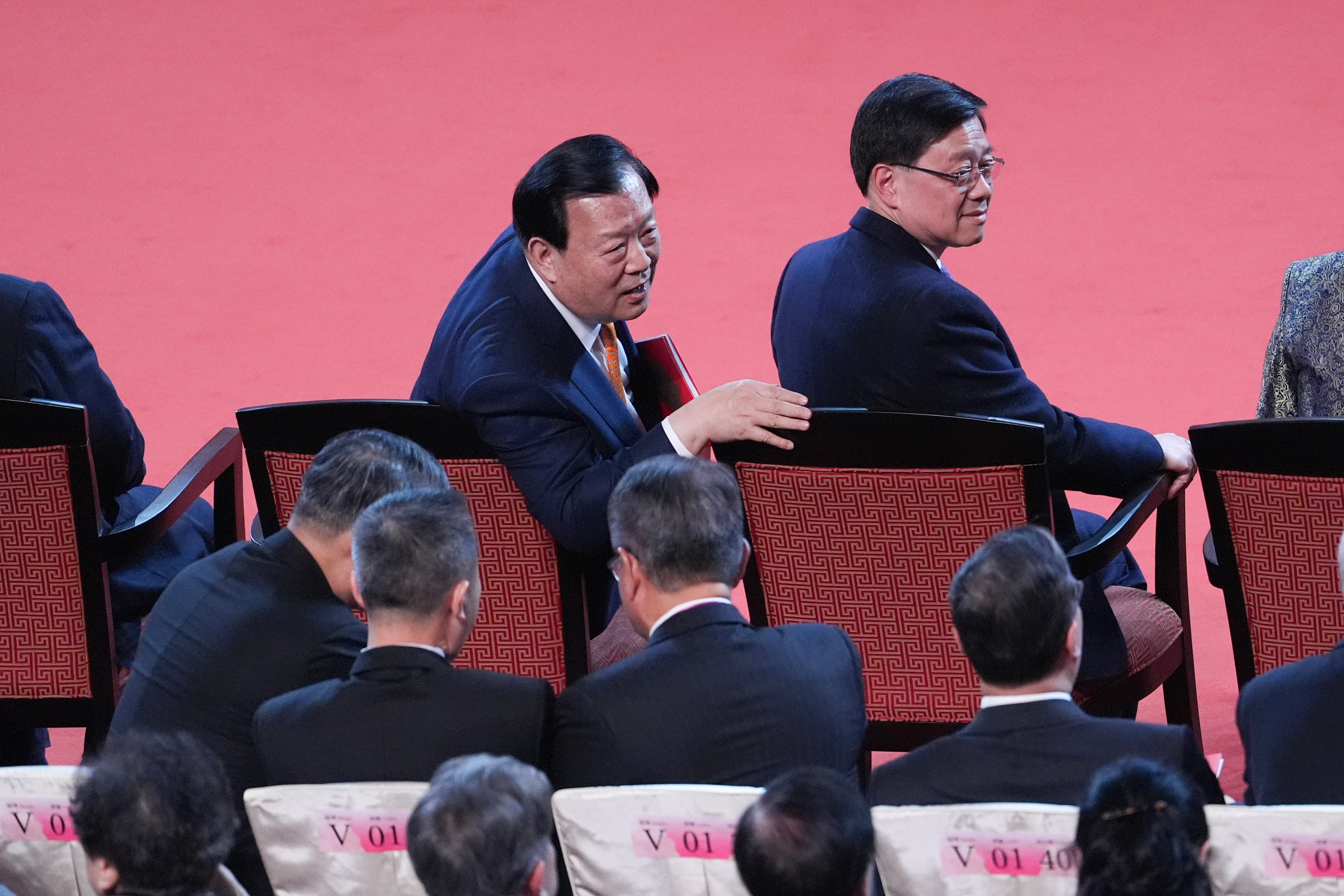 Xia Baolong (left), director of the Hong Kong and Macau Affairs Office, and John Lee. Xia has spelled out his expectations for businesses in a closed-door meeting on Monday. Photo: Eugene Lee