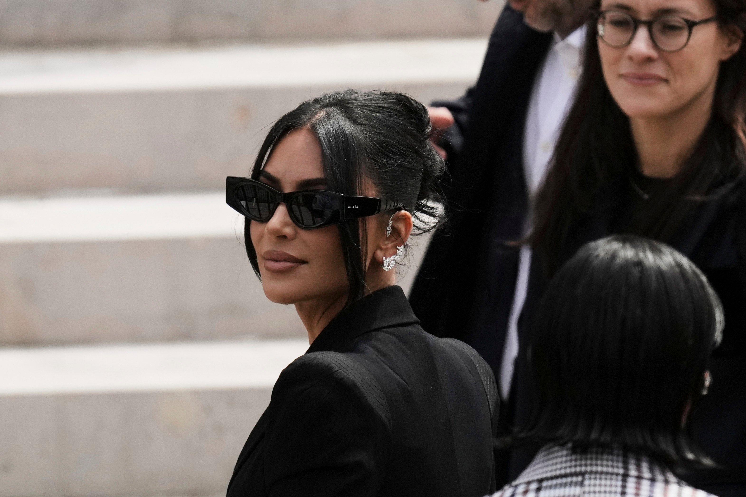 Kim Kardashian arrives to testify at a Paris court regarding a robbery of millions of dollars in jewels from her Paris hotel room in 2016 on Tuesday. Photo: AP