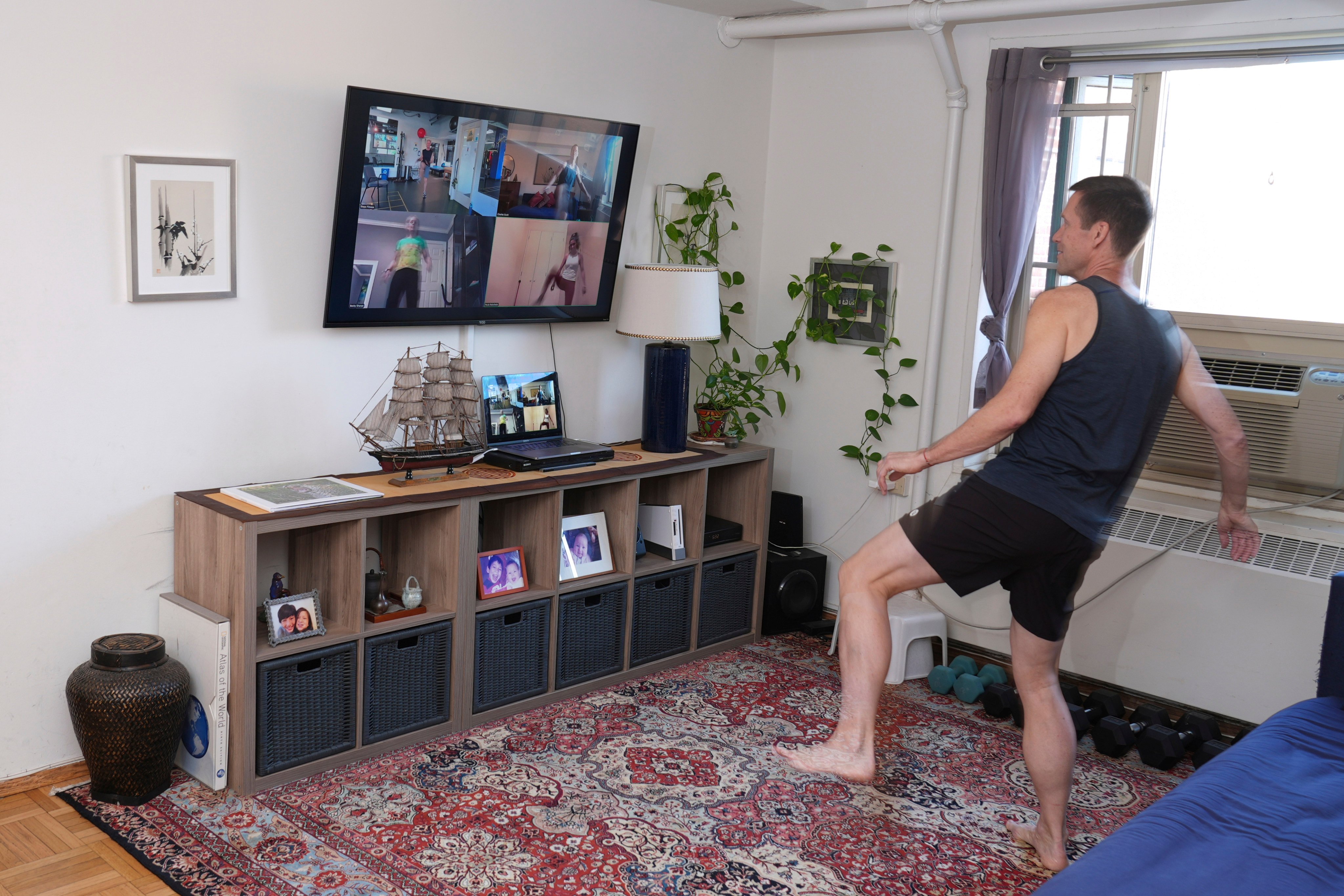 Charles Scott works out with people via Zoom. Photo: AP