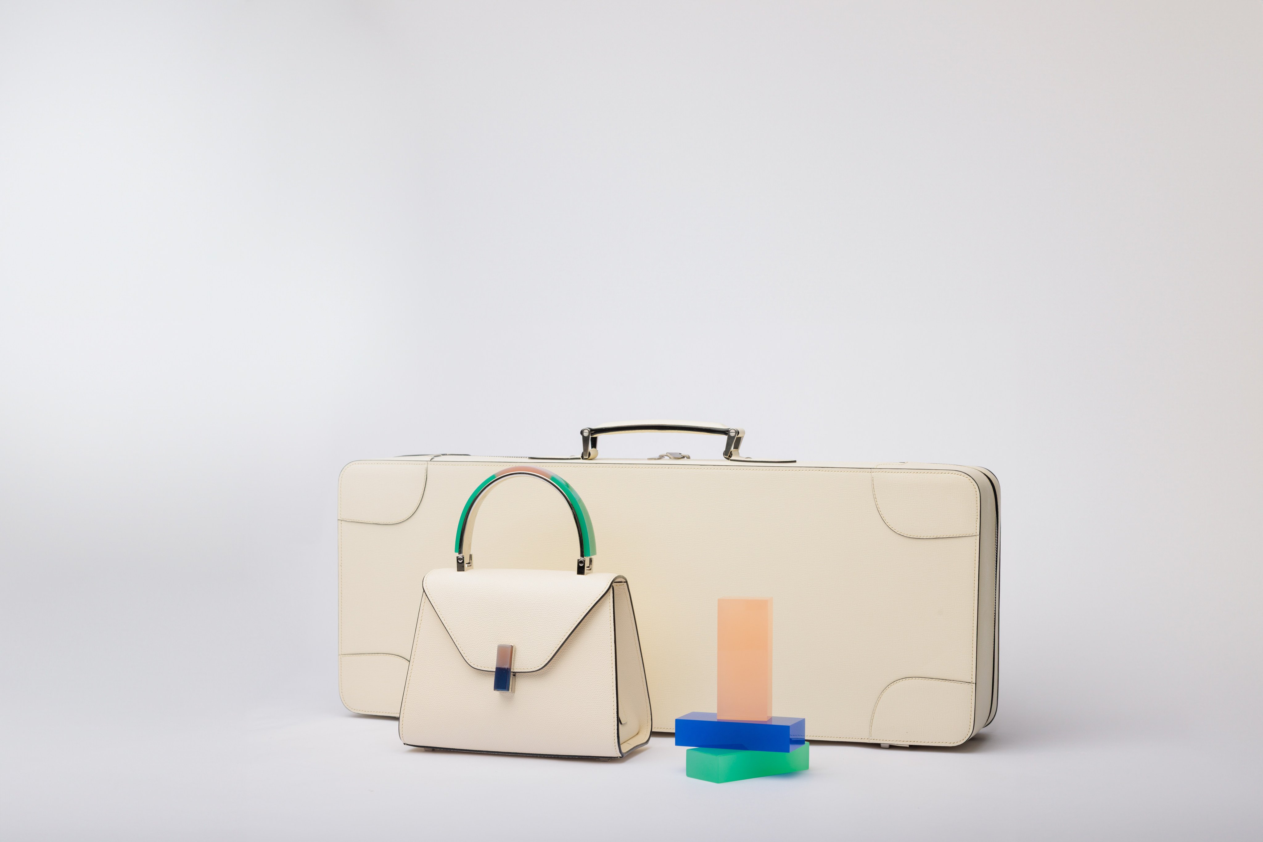 Loyal fans admire the subtle, understated style of Valextra leather goods, such as the Vocabolario 2.0 Costa 70 + Zaven suitcase and Iside Resin Dyes mini bag. Photo: Handout