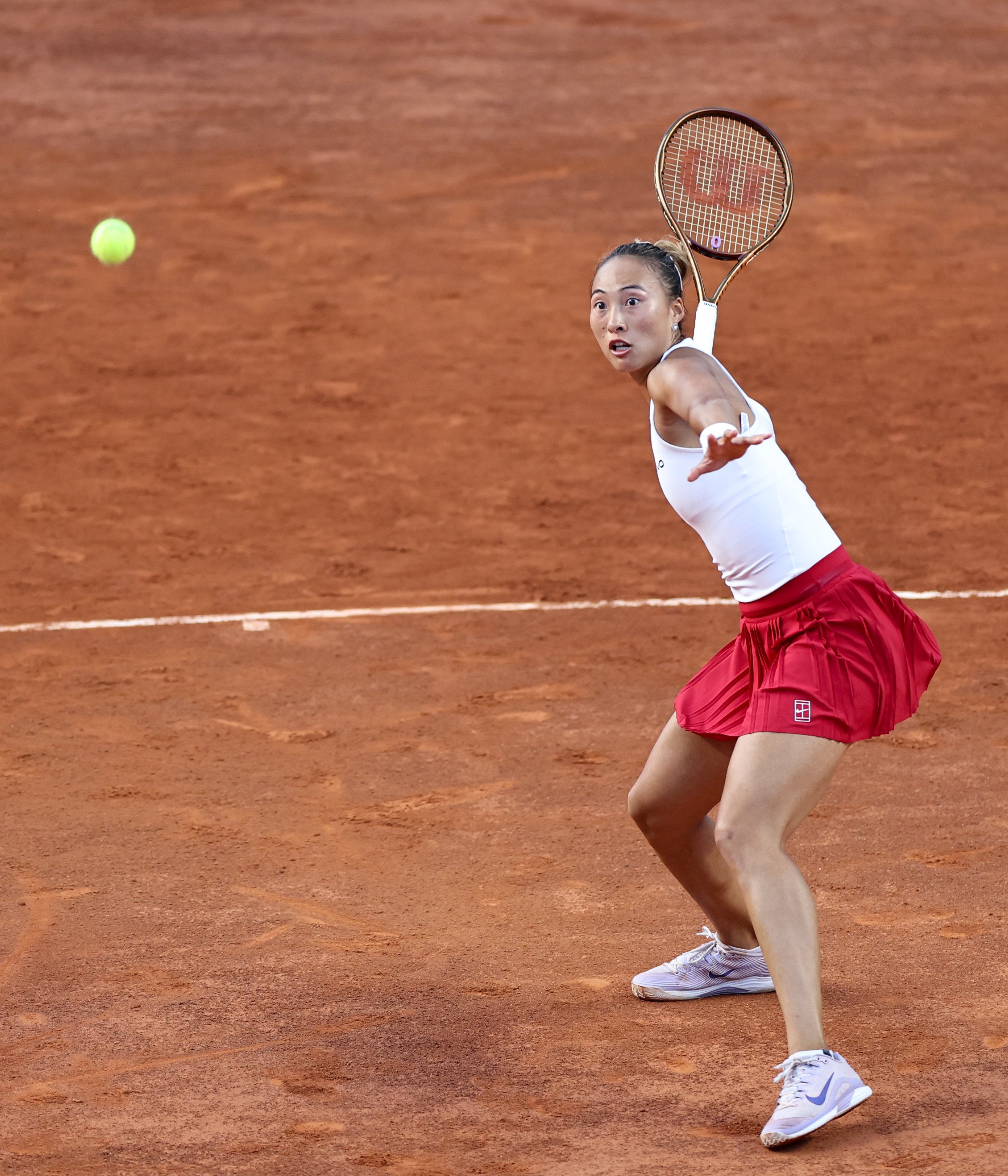 Zheng Qinwen returns a shot against Bianca Andreescu of Canada at the Italian Open in Rome on Monday. Photo: Xinhua