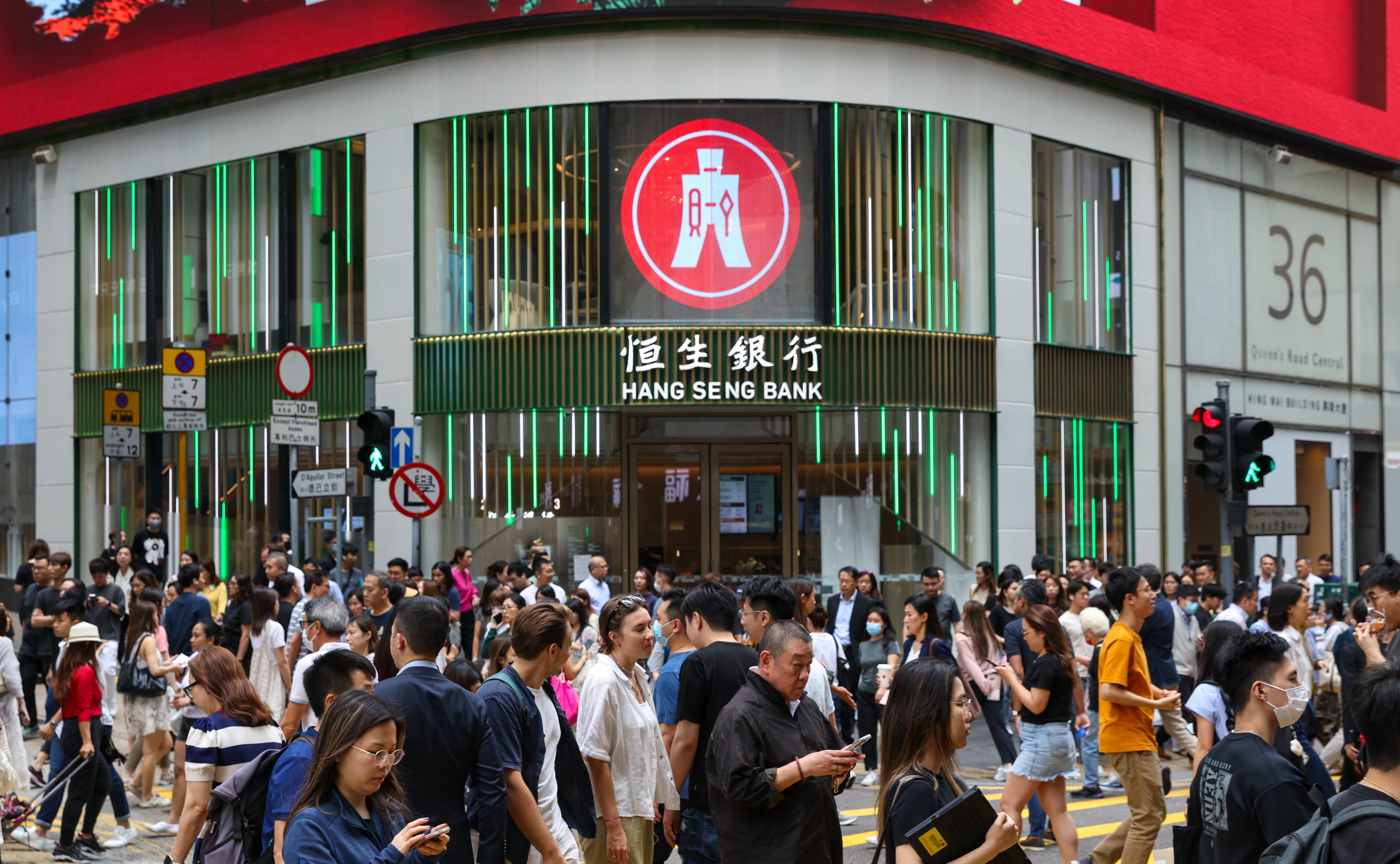 Commuters cross a street in Hong Kong’s Central district on May 17, 2024. Photo: Yik Yeung-man