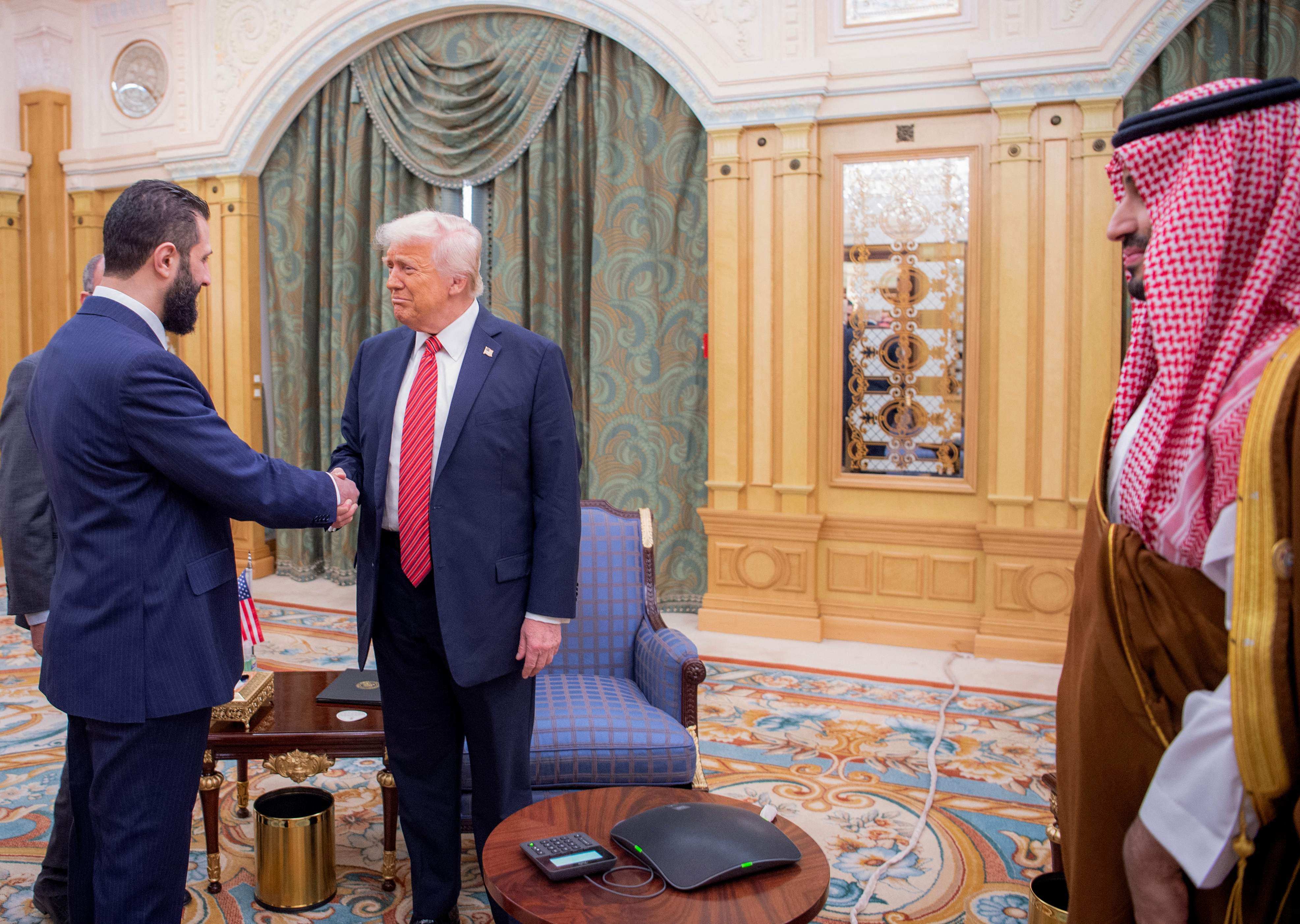 Saudi Crown Prince Mohammed bin Salman (right) watches as US President Donald Trump (middle) meets Syria’s interim President Ahmed al-Sharaa in Riyadh on Wednesday. Photo: AFP/Saudi Royal Palace/Bandar al-Jaloud
