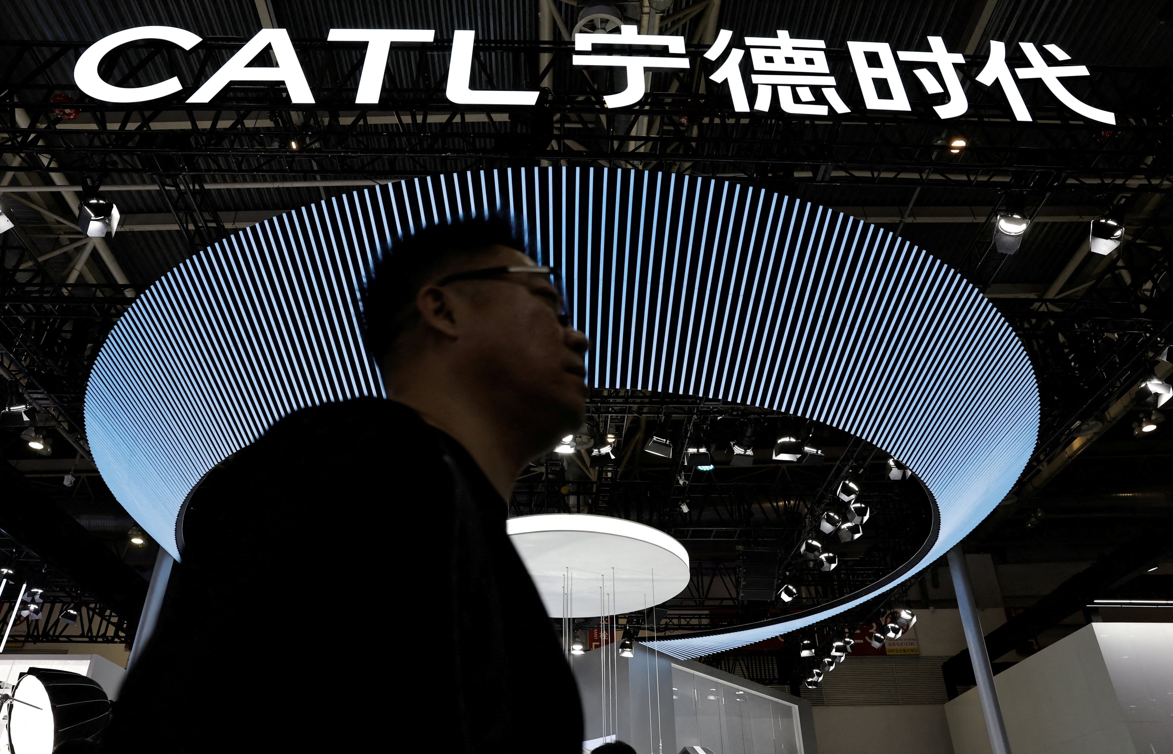 A man walks past CATL’s booth the the Auto China 2024 show in Beijing in 2024. Photo: Reuters
