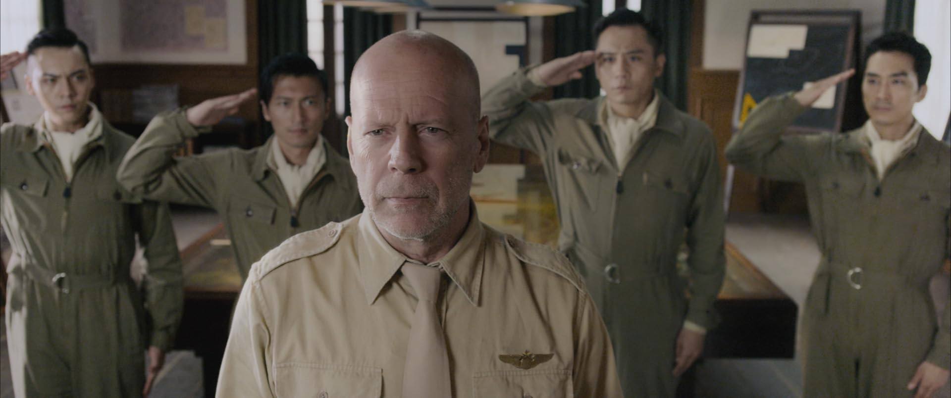 Bruce Willis (front) and co-stars in a still from Air Strike. Photo: Online