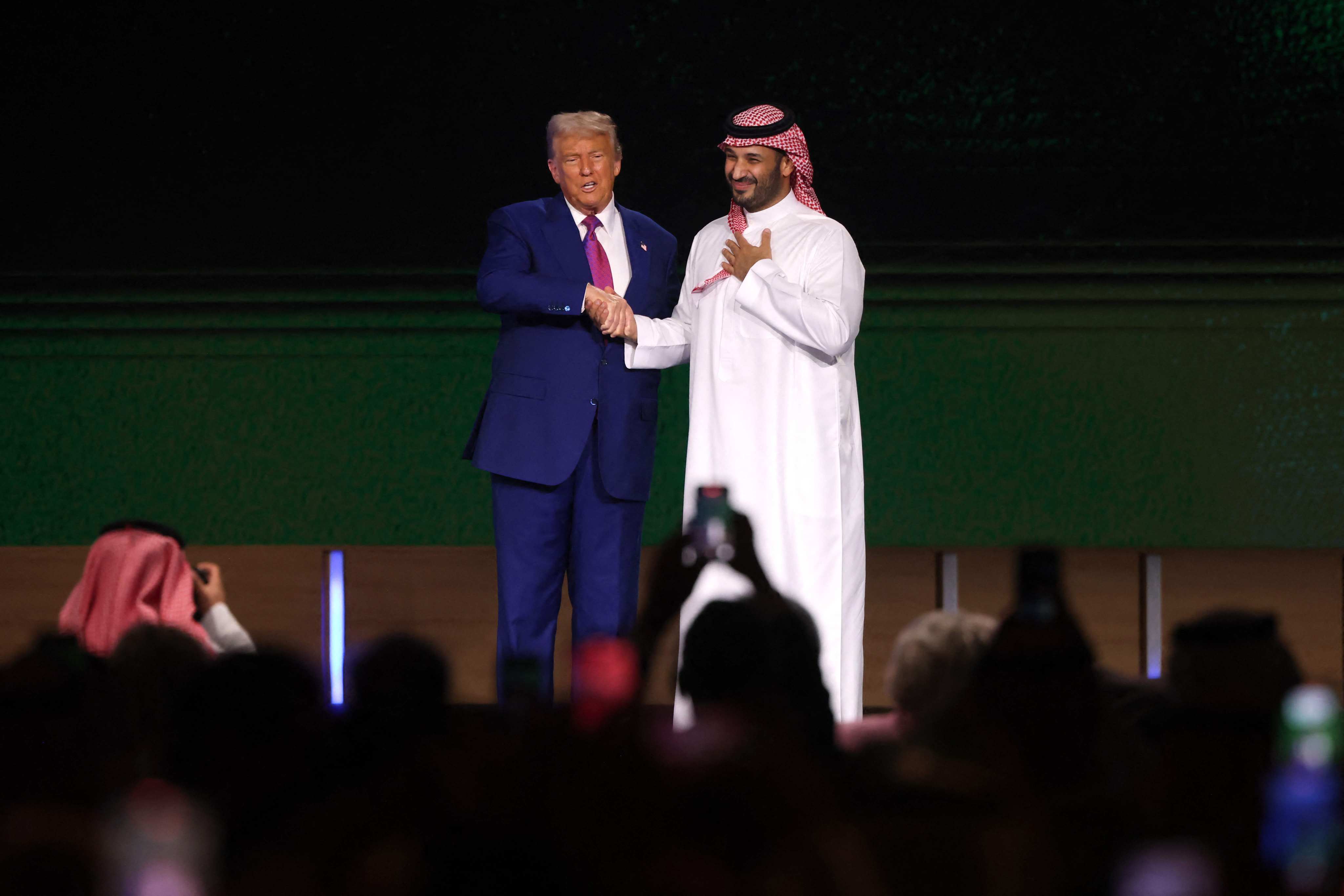 US President Donald Trump shakes hands with Saudi Crown Prince Mohammed bin Salman at an investment forum in Riyadh on Tuesday. Photo: AFP