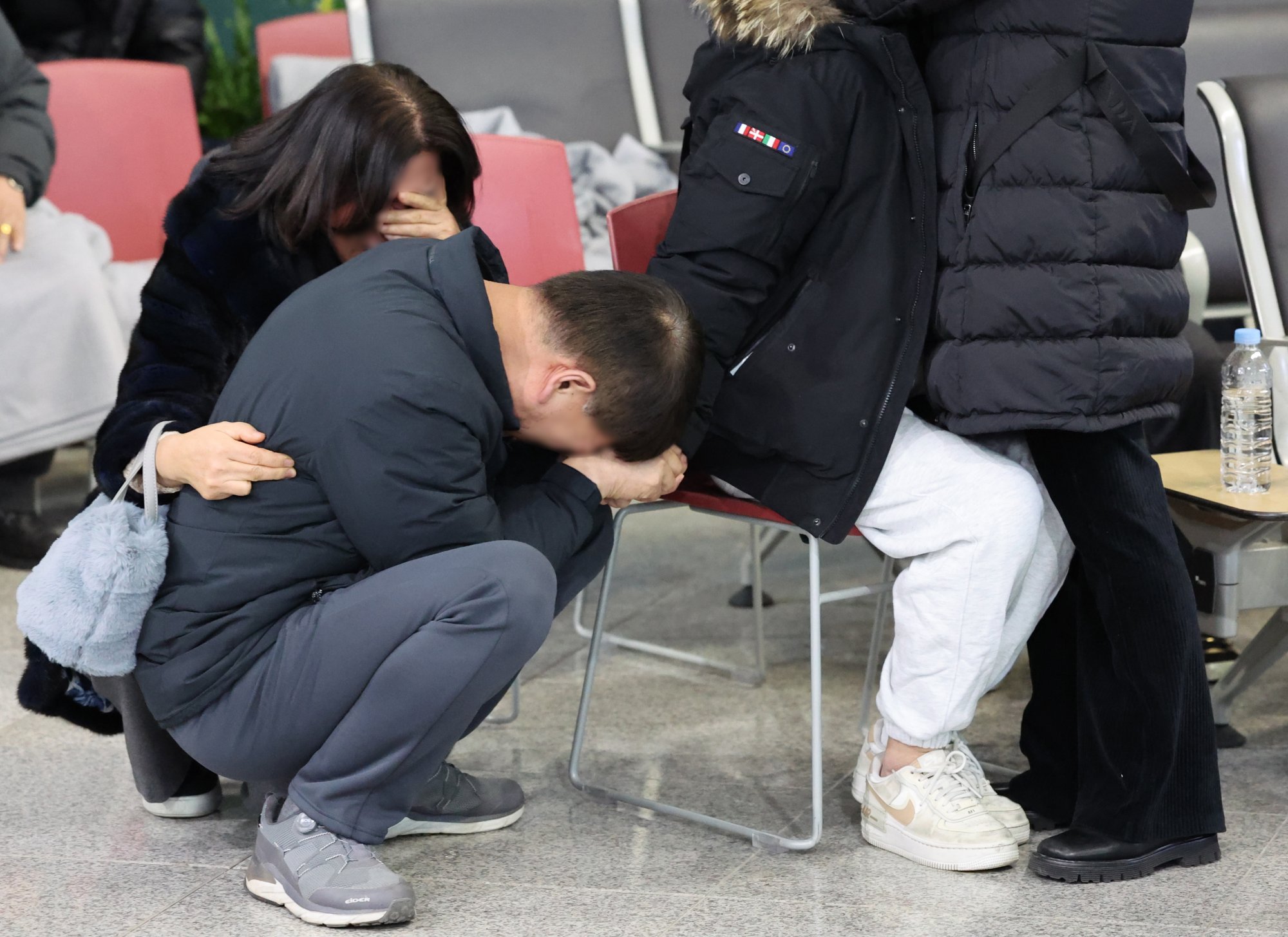 Family members of a victim of the Jeju Air plane crash grieve at Muan International Airport in South Korea on December 29 last year. Photo: Yonhap/EPA-EFE Family members of a victim of the Jeju Air plane crash grieve at Muan International Airport in South Korea on December 29 last year. Photo: Yonhap/EPA-EFE