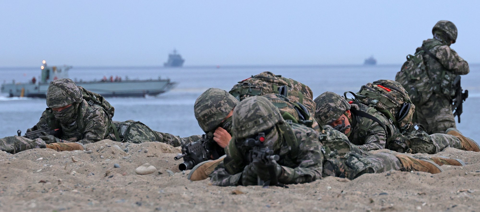 South Korean marines take aim with their rifles after dashing out of an assault amphibious vehicle during a landing drill in Pohang, North Gyeongsang province, on April 28. Photo: EPA-EFE/Yonhap South Korean marines take aim with their rifles after dashing out of an assault amphibious vehicle during a landing drill in Pohang, North Gyeongsang province, on April 28. Photo: EPA-EFE/Yonhap