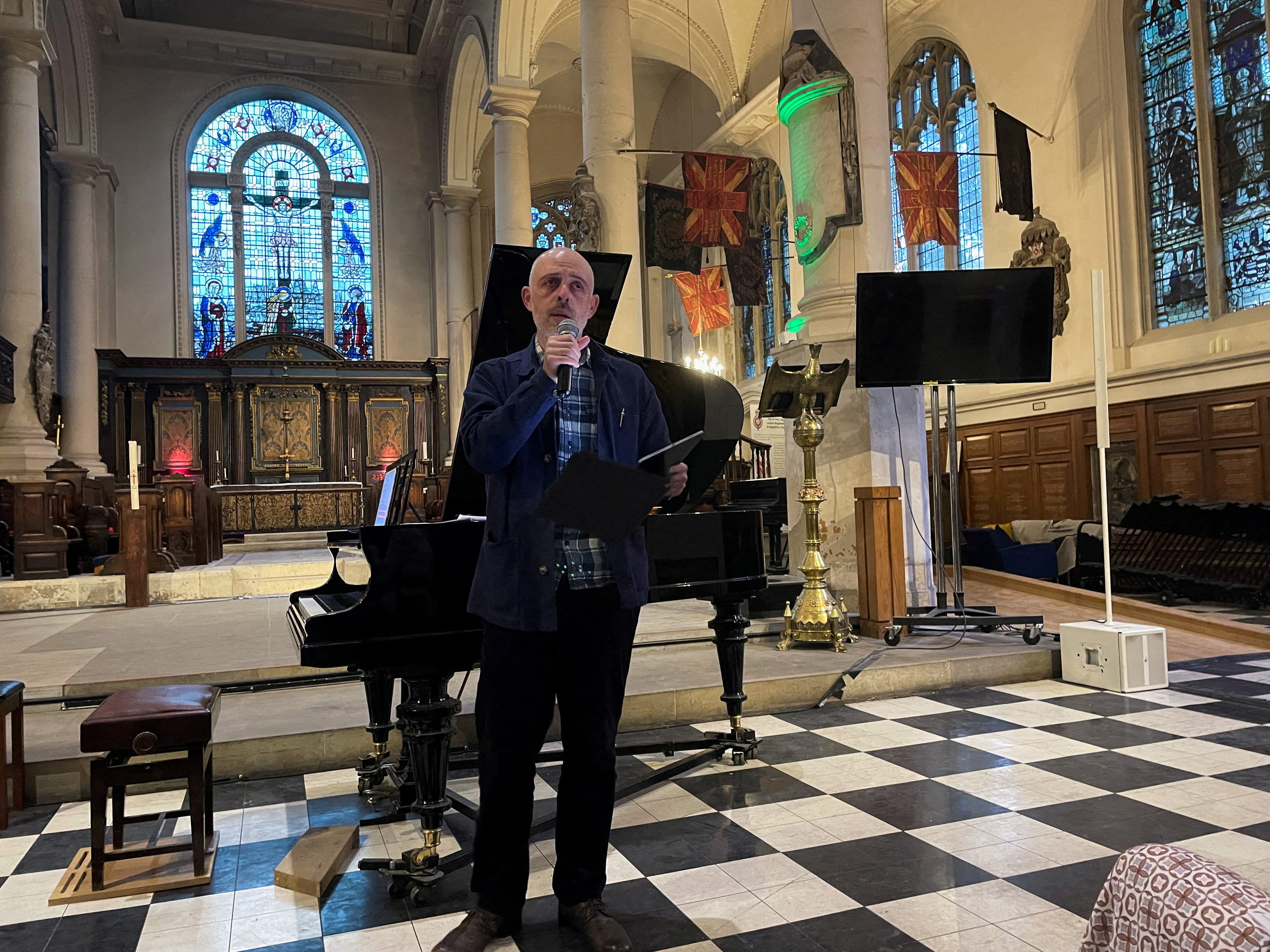 Russian filmmaker Roma Liberov addresses the audience at a concert he organised in memory of Pavel Kushnir, a pianist who died in a Russian prison in 2024, in a church in London, England, on May 10, 2025. Photo: Reuters