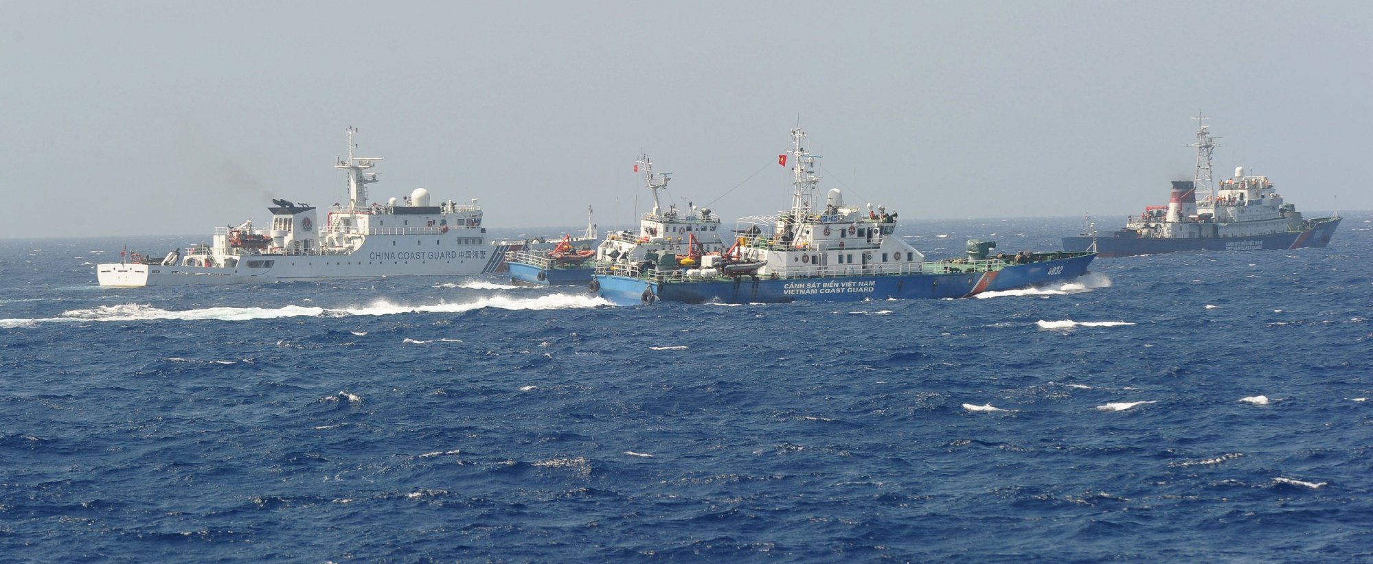 A Chinese coastguard ship (left) being blocked by three Vietnamese coastguard vessels near China’s oil drilling rig in disputed waters in the South China Sea in May 2014. Photo: AFP A Chinese coastguard ship (left) being blocked by three Vietnamese coastguard vessels near China’s oil drilling rig in disputed waters in the South China Sea in May 2014. Photo: AFP