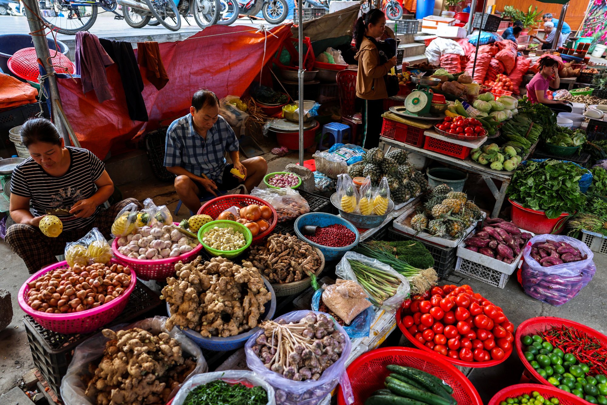 Vendors seen at their fruit stalls inside a market in Dong Dang township, Vietnam, in April after Trump had announced a 46 per cent tariff on the country. Photo: Reuters Vendors seen at their fruit stalls inside a market in Dong Dang township, Vietnam, in April after Trump had announced a 46 per cent tariff on the country. Photo: Reuters