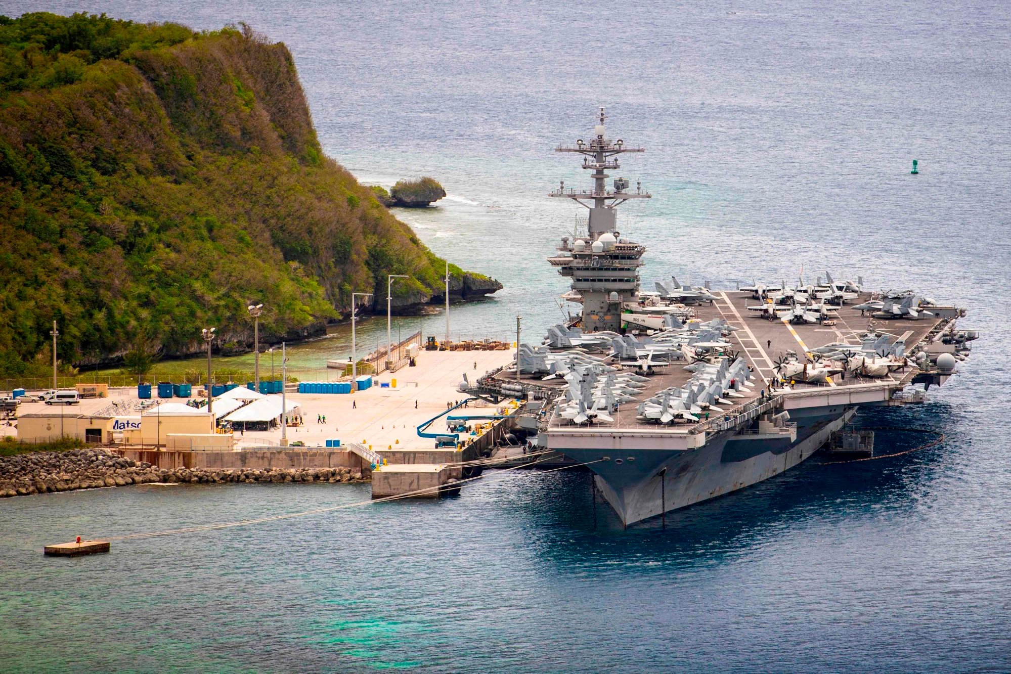 A US aircraft carrier is seen moored at a naval base in Guam in the Pacific Ocean. Photo: US Navy A US aircraft carrier is seen moored at a naval base in Guam in the Pacific Ocean. Photo: US Navy
